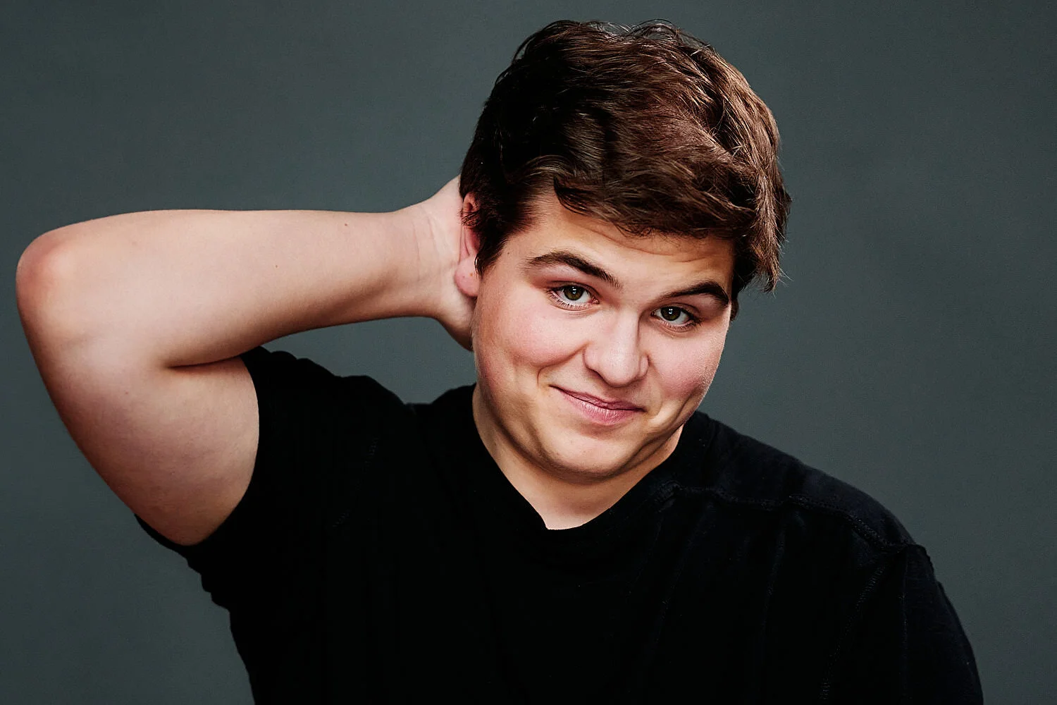  A teenage actor headshot for a Sewickley Academy’s high school senior musical “Fiddler on the Roof” in 2020. The portraits is done in a professional photography studio, low key, black and white. 