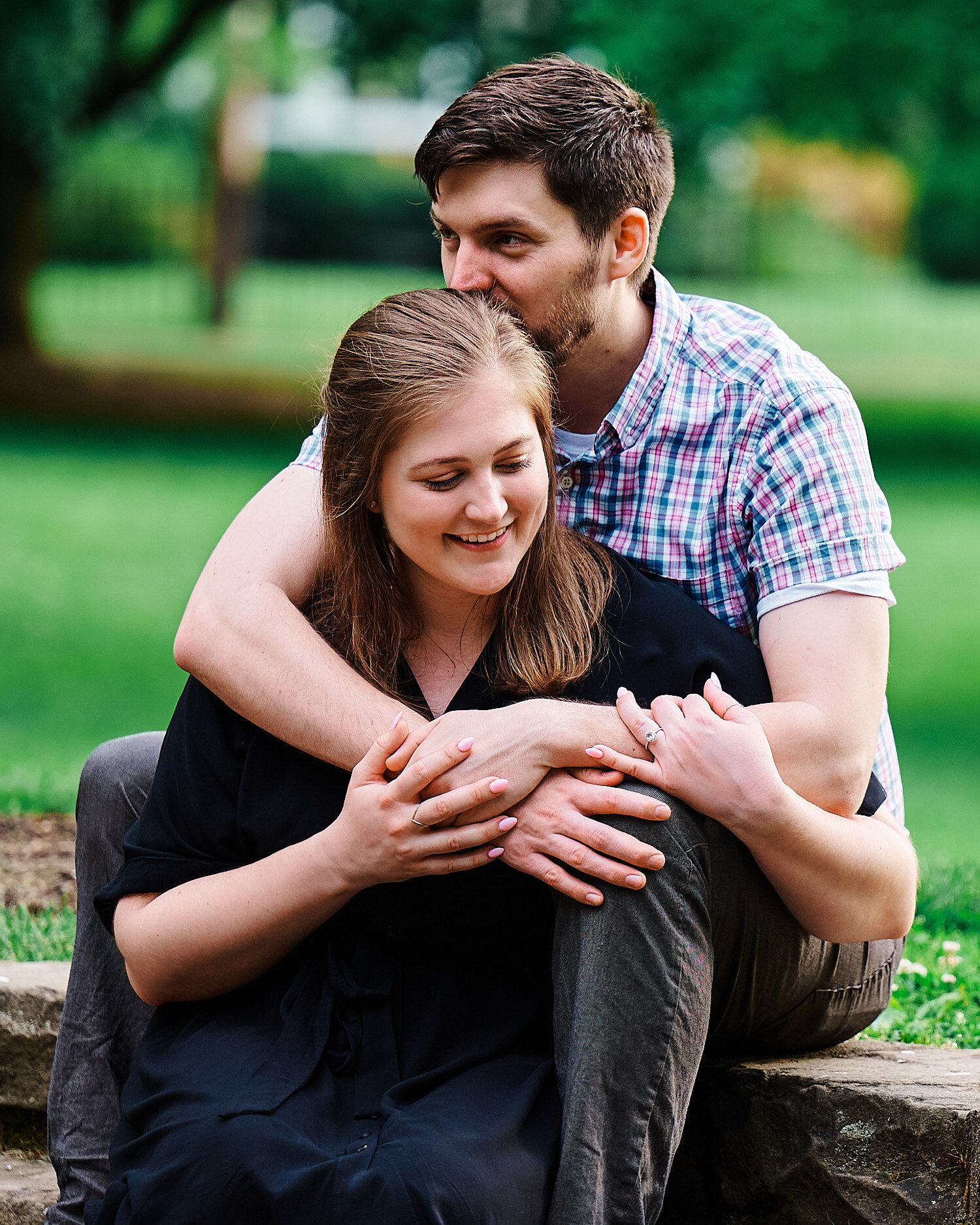  Katie Trovato and Jake Carrigan are posing for their surprise engagement photos. It was a surprise session in the park Sewickley, PA where Katue used to climb trees with her sister Sarah as a child. 