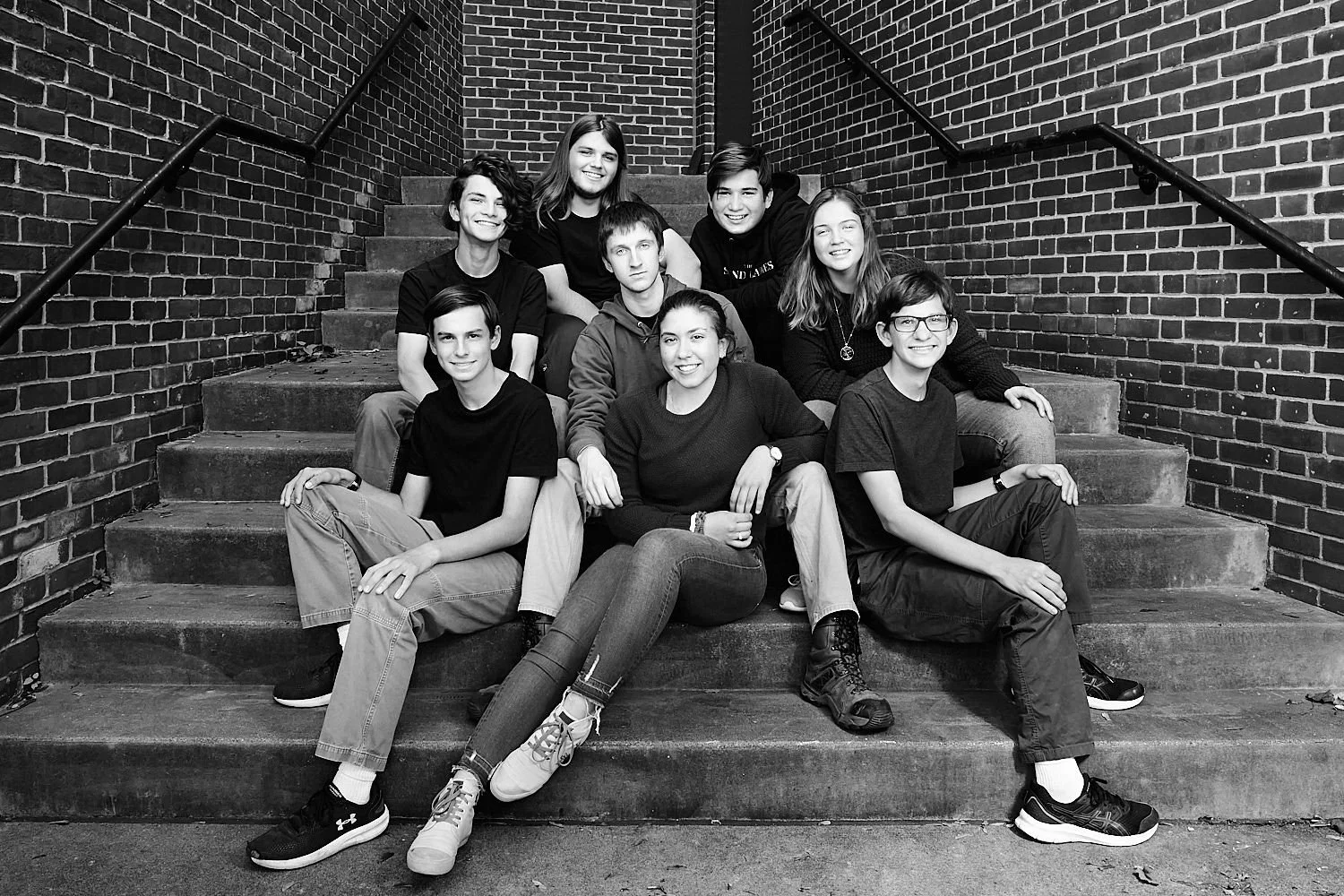  high school students are posing for a group pho for Sewickley Academy’s Fall 2021 theater play “12 Angry Jurors”. The young actor is professionally lit against grey background. 