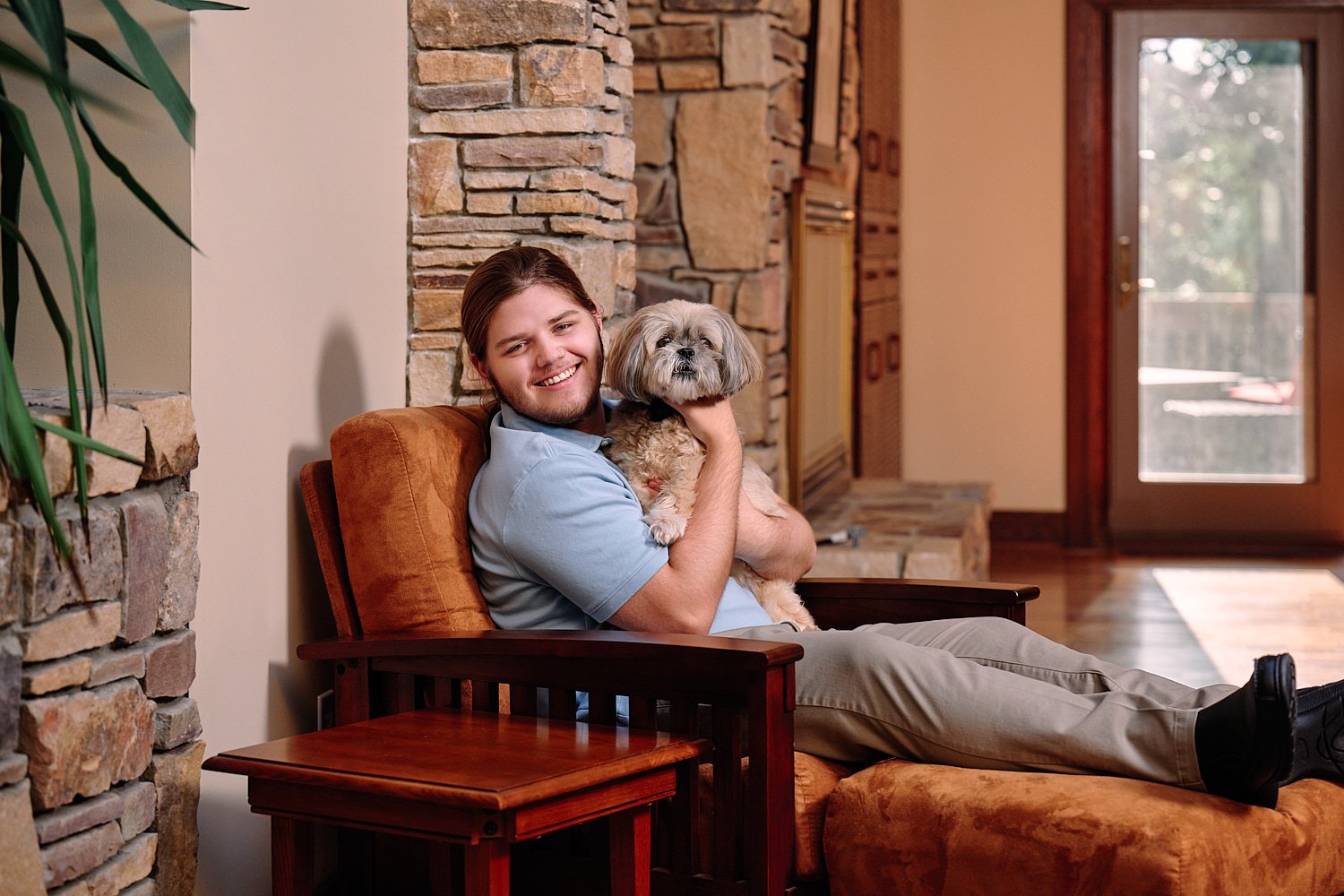  Zach Elkin of SA is posing for high school senior portraits in his family home in Sewickley Heights. He looks handsome in suit, polo shirt and playing with his dogs - in the backyard and in the house 