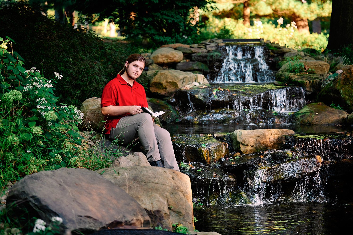  Zach Elkin of SA is posing for high school senior portraits in his family home in Sewickley Heights. He looks handsome in suit, polo shirt and playing with his dogs - in the backyard and in the house 