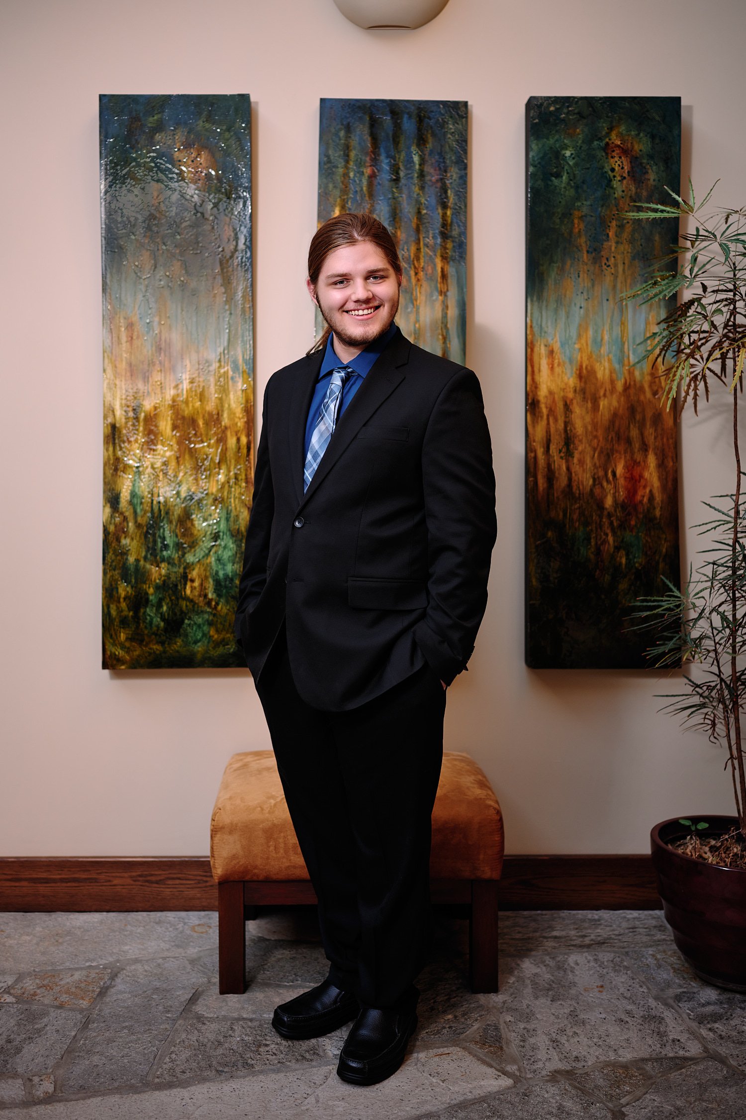  Zach Elkin of SA is posing for high school senior portraits in his family home in Sewickley Heights. He looks handsome in suit, polo shirt and playing with his dogs - in the backyard and in the house 