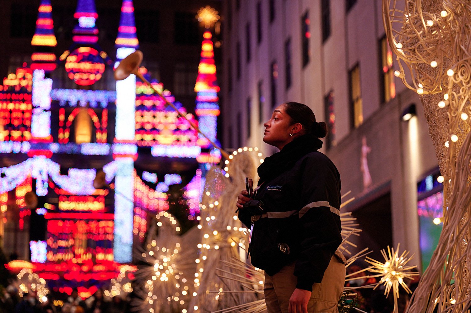  NEW YORK CITY, USA  - DECEMBER 9TH 2021: people enjoying holiday lights and Christmas Displays at Rockefeller Center and Saks Fifth Avenue. Very few are wearing facial masks despite Omicron pandemic. 