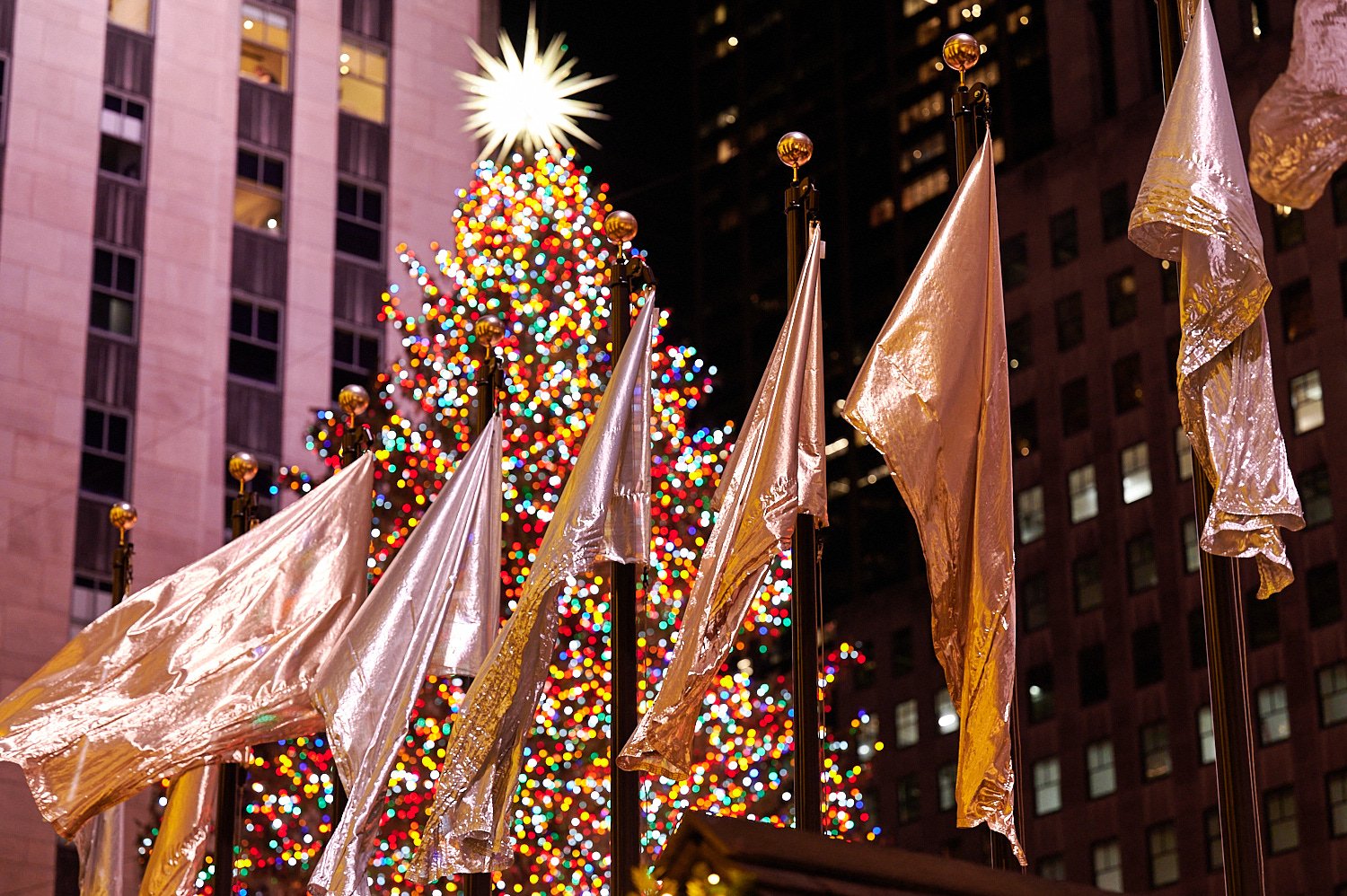  NEW YORK CITY, USA  - DECEMBER 9TH 2021: people enjoying holiday lights and Christmas Displays at Rockefeller Center and Saks Fifth Avenue. Very few are wearing facial masks despite Omicron pandemic. 