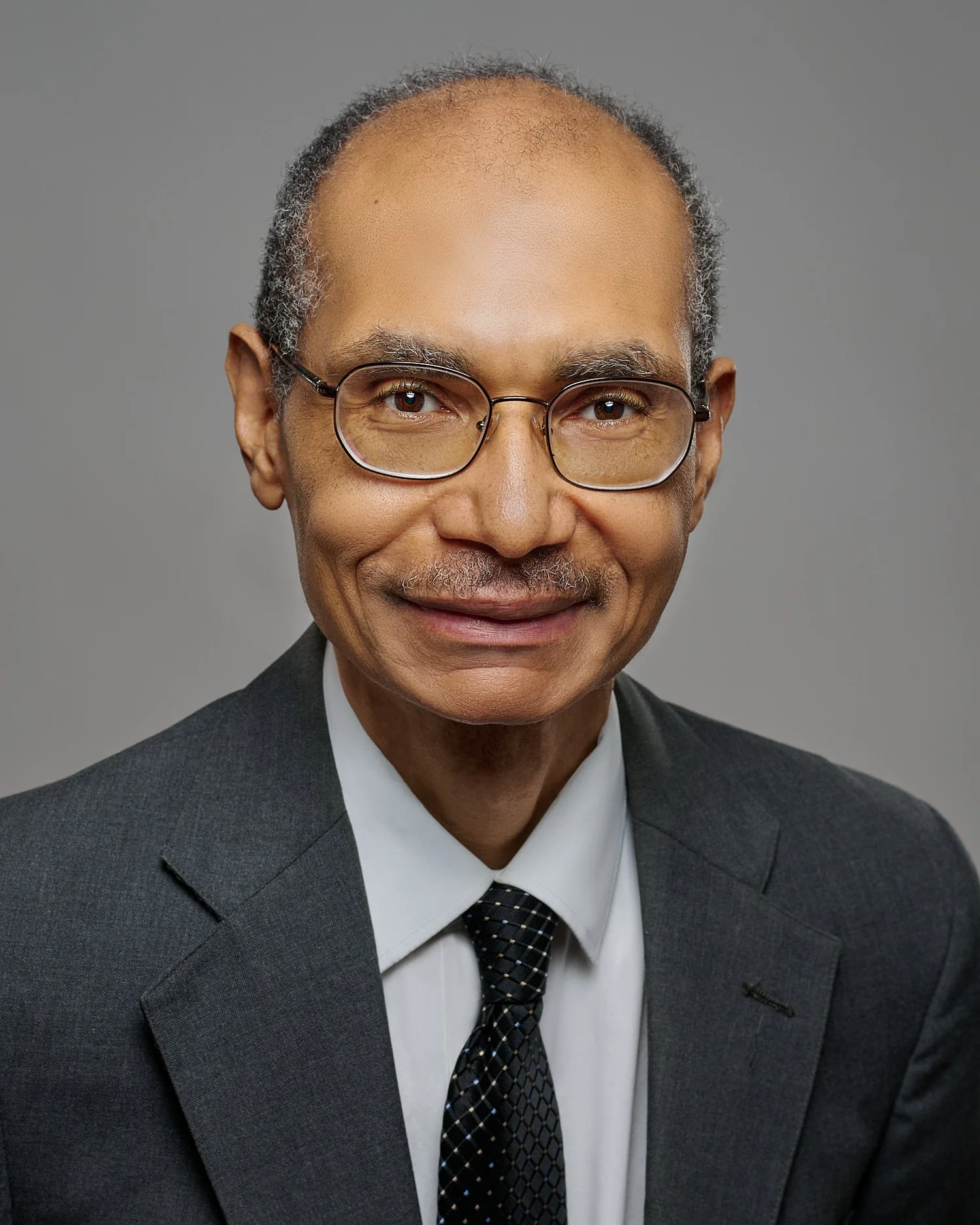  SEWICKLEY, PA, USA  - JANUARY 29TH 2022: Sherman D. Bailey is posing for business headshots for his certified engineer job applications and social media pages. He has short curly hair and eyeglasses. 
