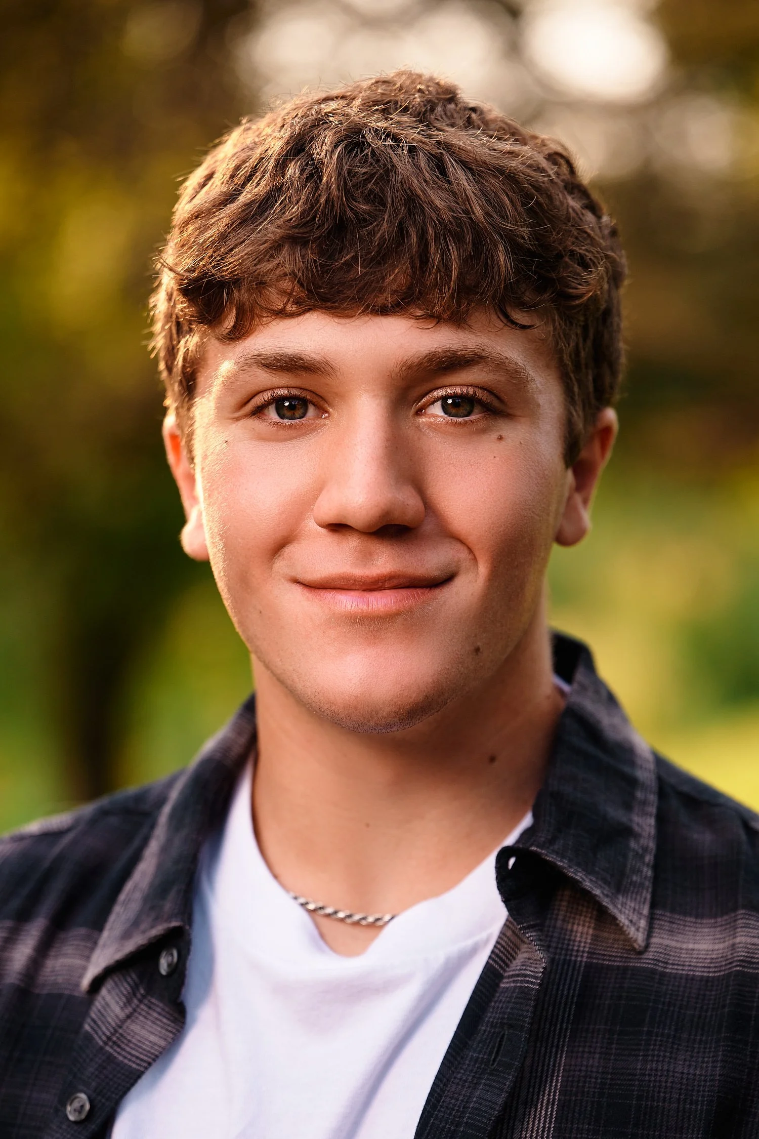  Colin Elias is posing for his high school senior portraits at Robin hill Park and at the baseball field in Moon park near Pittsburgh, PA. It’s still hot and sunny in September and feels like summer. 