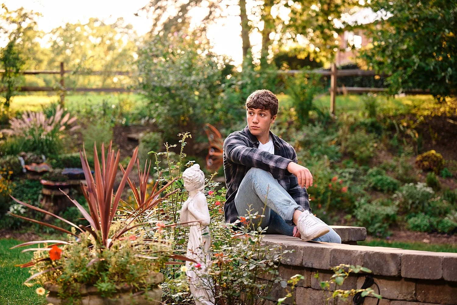  Colin Elias is posing for his high school senior portraits at Robin hill Park and at the baseball field in Moon park near Pittsburgh, PA. It’s still hot and sunny in September and feels like summer. 
