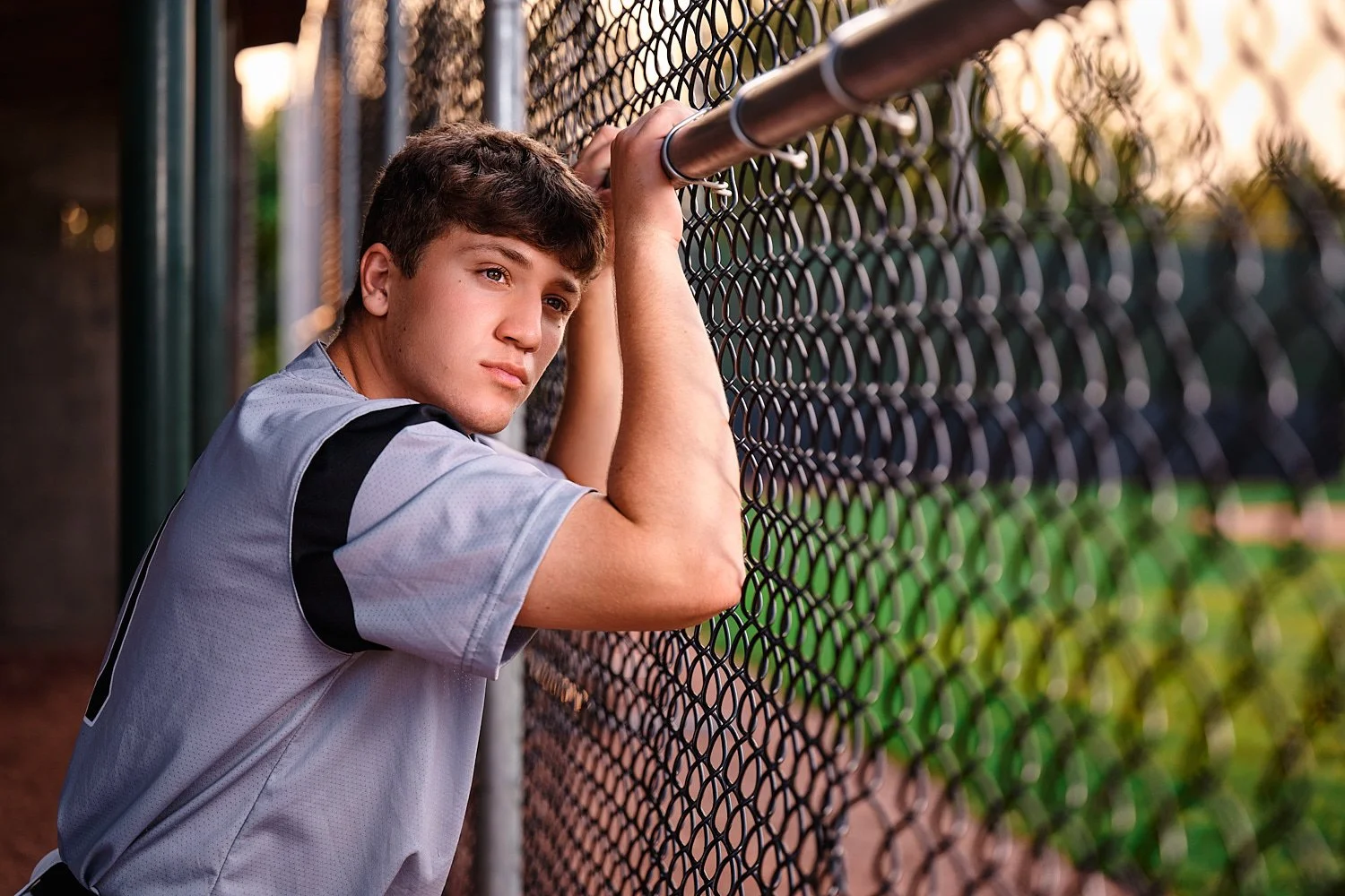  Colin Elias is posing for his high school senior portraits at Robin hill Park and at the baseball field in Moon park near Pittsburgh, PA. It’s still hot and sunny in September and feels like summer. 
