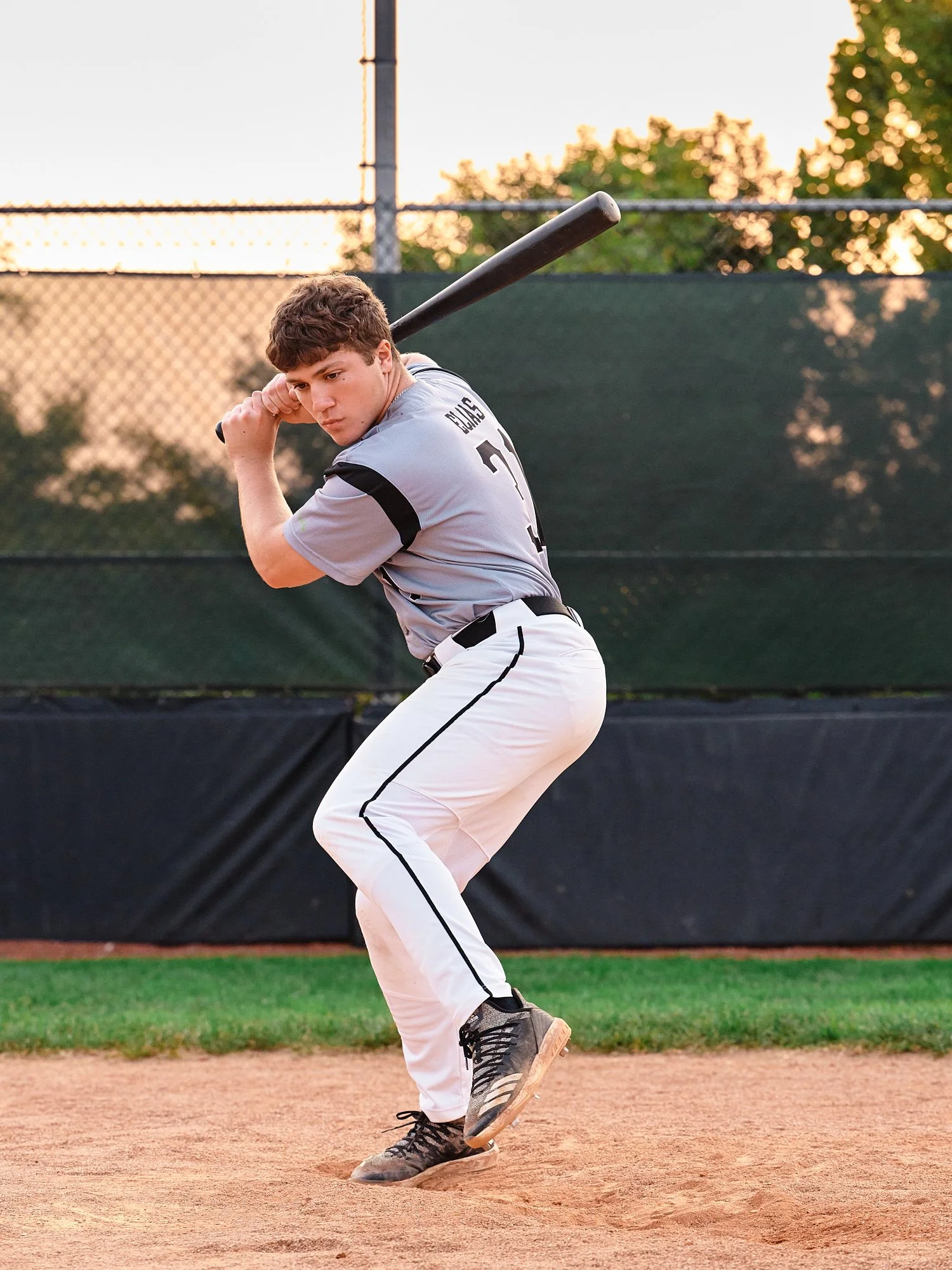  Colin Elias is posing for his high school senior portraits at Robin hill Park and at the baseball field in Moon park near Pittsburgh, PA. It’s still hot and sunny in September and feels like summer. 