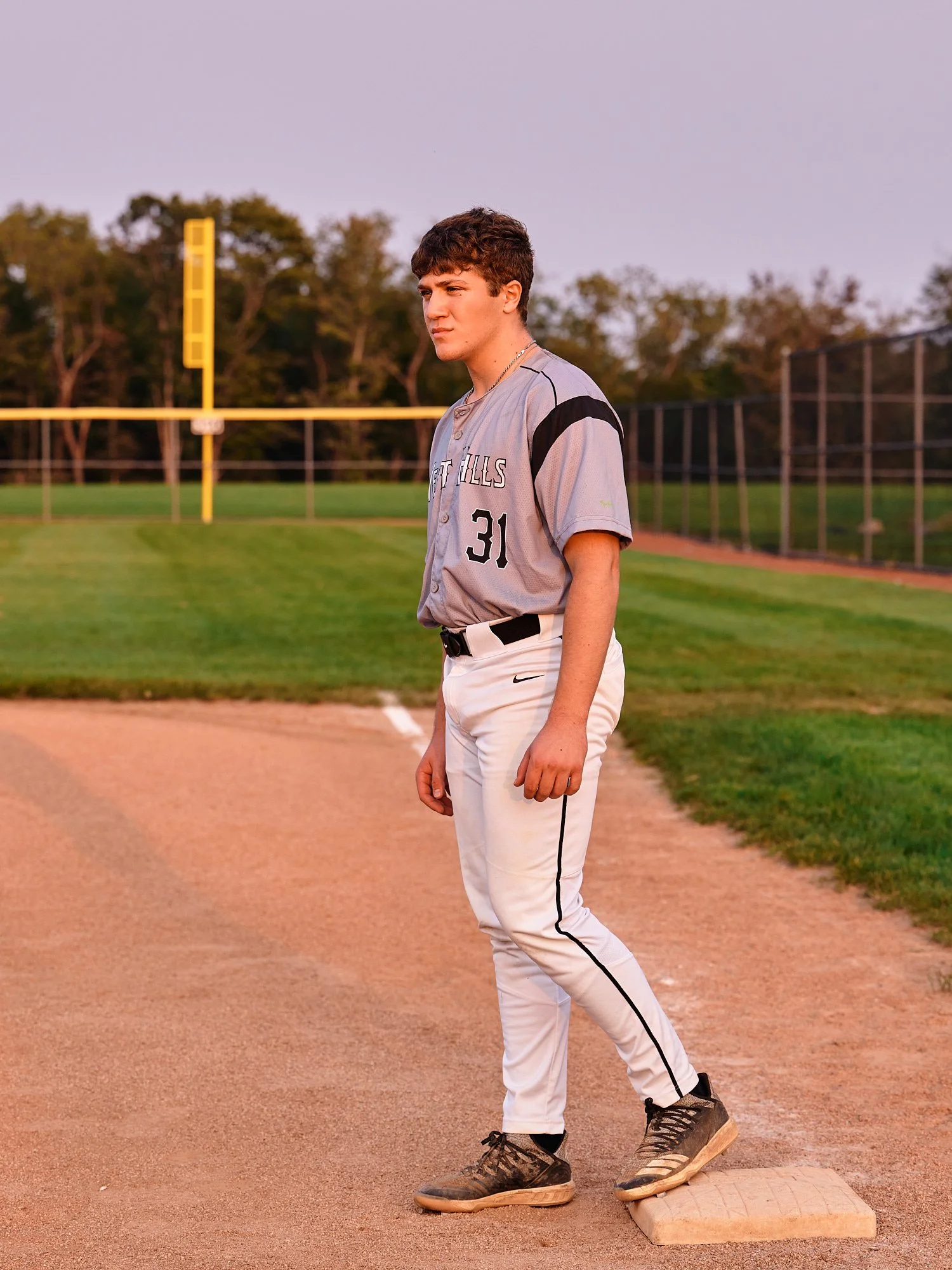  Colin Elias is posing for his high school senior portraits at Robin hill Park and at the baseball field in Moon park near Pittsburgh, PA. It’s still hot and sunny in September and feels like summer. 