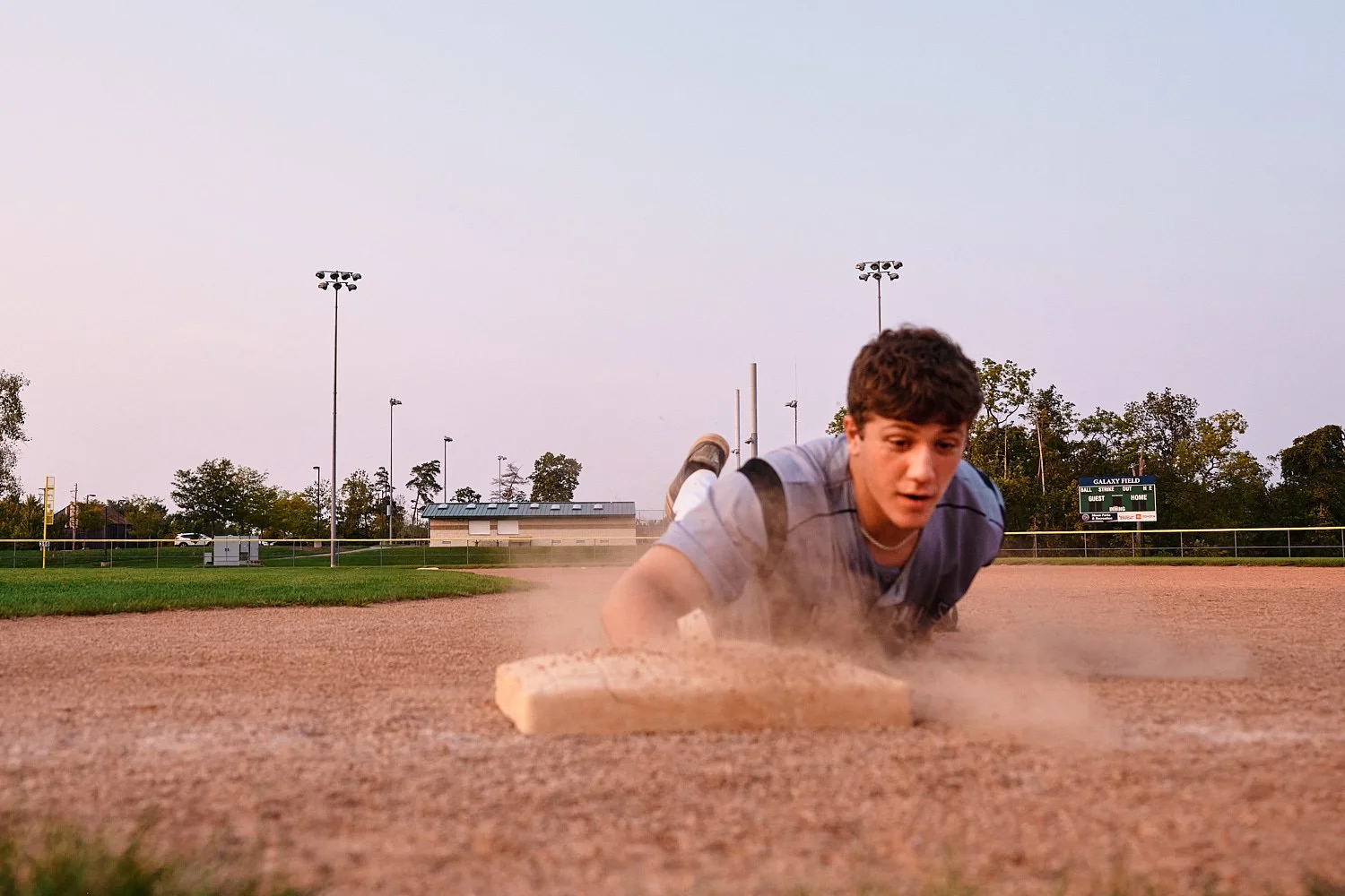  Colin Elias is posing for his high school senior portraits at Robin hill Park and at the baseball field in Moon park near Pittsburgh, PA. It’s still hot and sunny in September and feels like summer. 