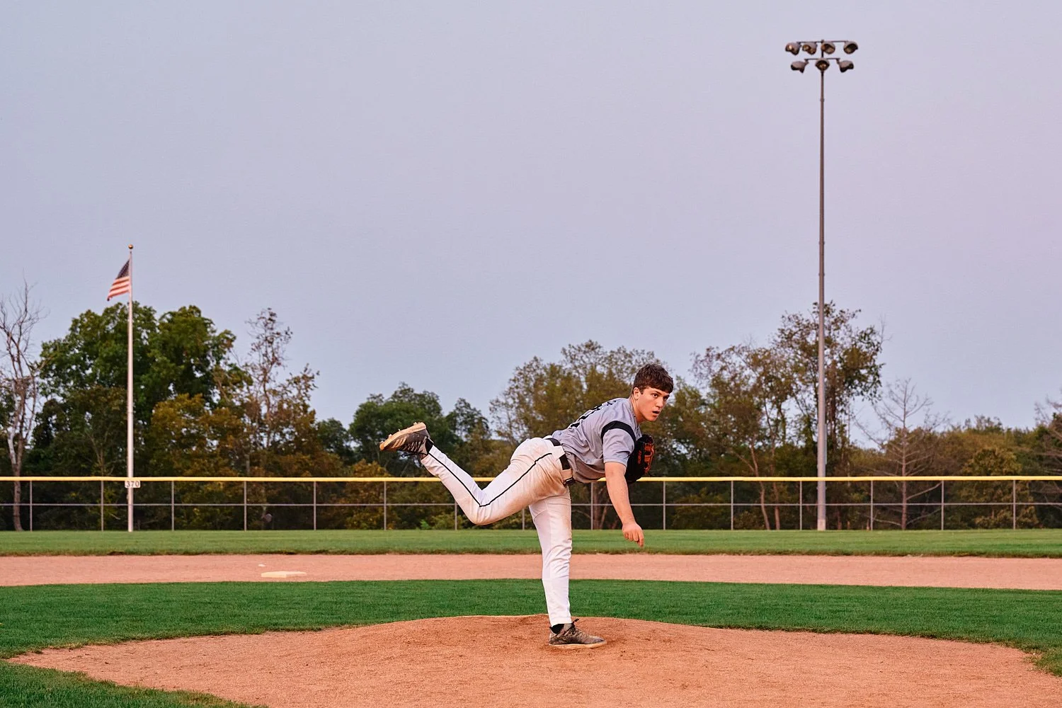 Colin Elias is posing for his high school senior portraits at Robin hill Park and at the baseball field in Moon park near Pittsburgh, PA. It’s still hot and sunny in September and feels like summer. 