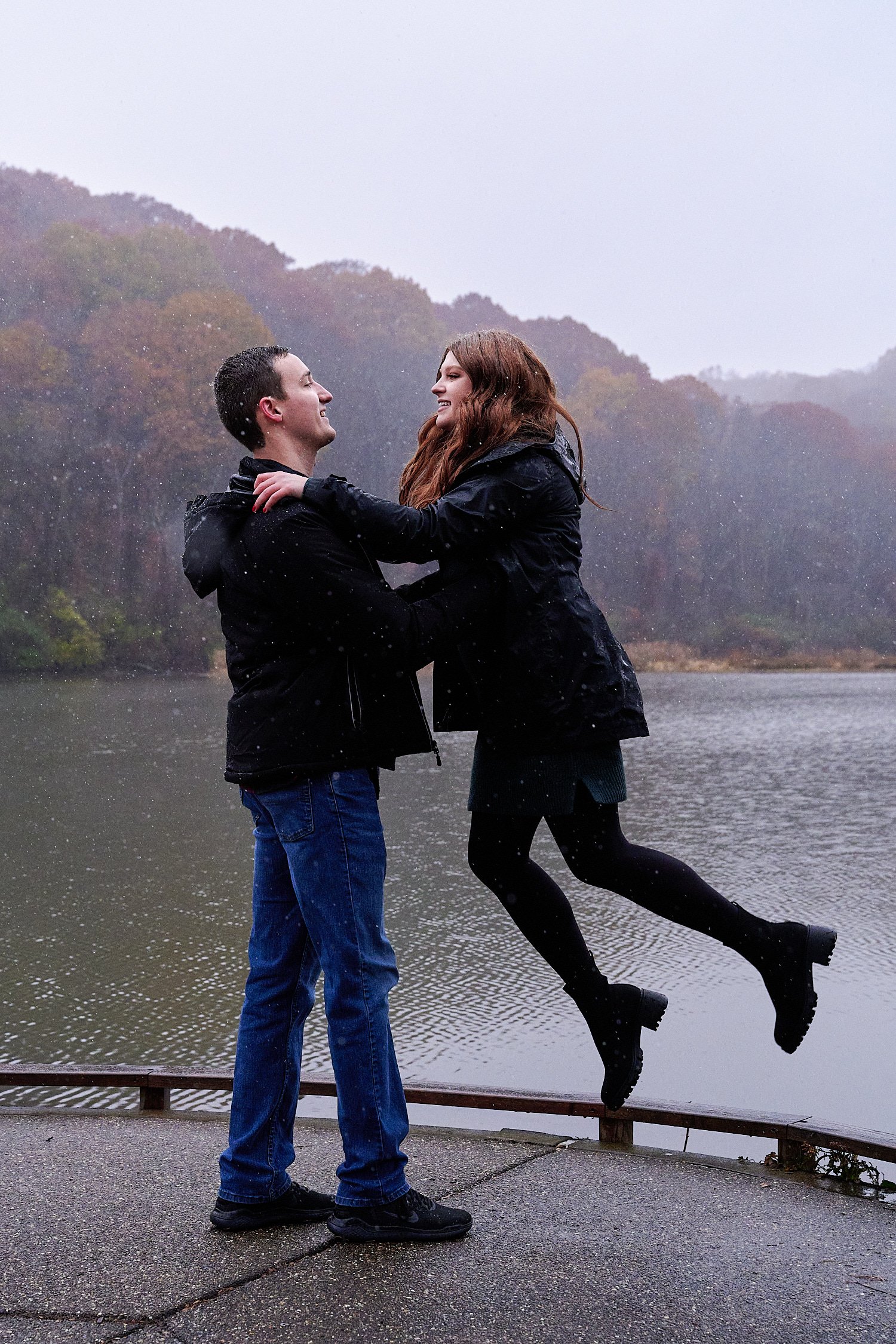  Victoria Detweiler is posing with her new husband on Marshall Island in North Park, Allegheny County near Pittsburgh, Pennsylvania. It’s very cold and it’s snowing. The trees around have few colors. 