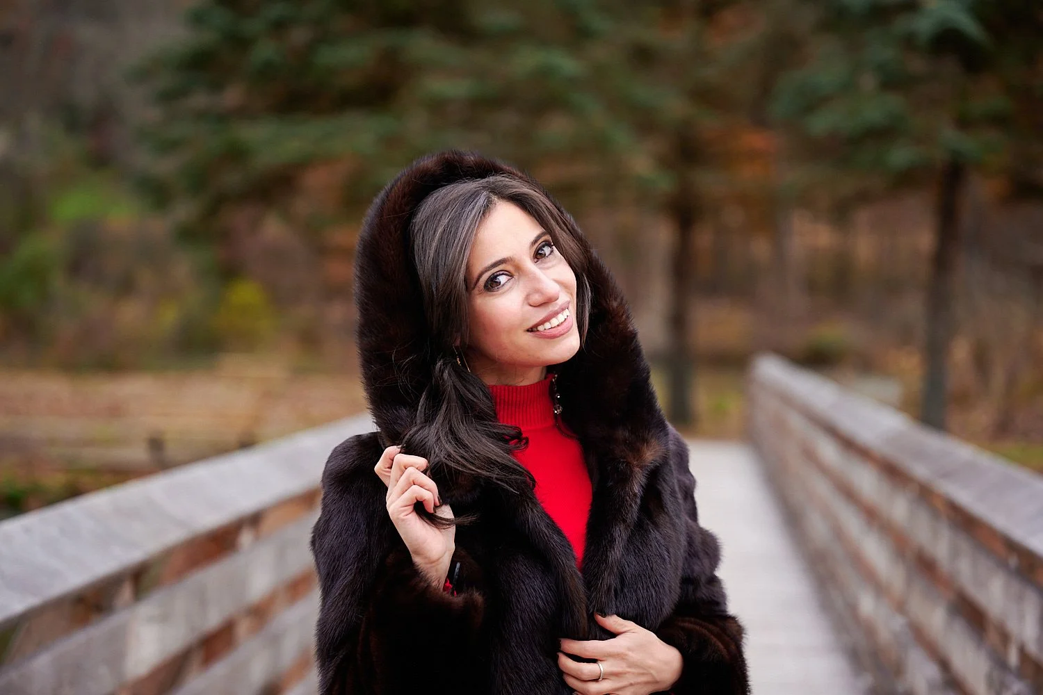  Rufa Akhmedli is posing in North Park near Pittsburgh, Pennsylvania. The young lady will use her business portraits for personal branding and her influencer Instagram account. It’s very cold, snowing 