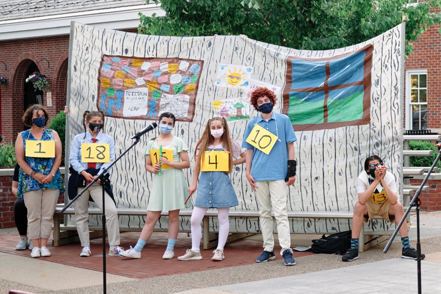  Sewickley Academy High School students are performing the spring musical “The 25th Annual Putnam County Spelling Bee.” The show is staged outdoors in a socially distant format with facial masks on. 