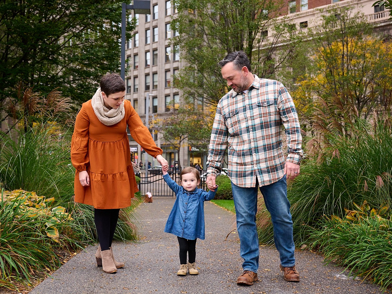  Amanda Norris is posing for a family photoshoot with her husband and her two-year-old daughter in city square of Pittsburgh Downtown, Western Pennsylvania. Amanda is pregnant with her second child. 