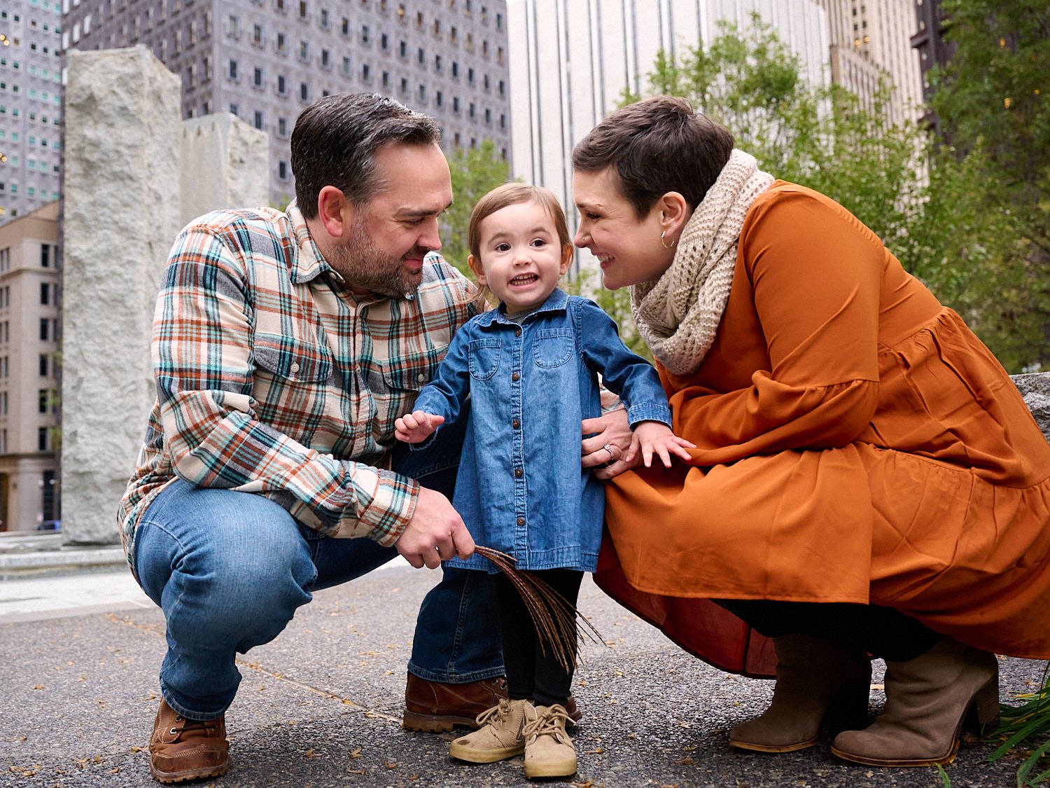  Amanda Norris is posing for a family photoshoot with her husband and her two-year-old daughter in city square of Pittsburgh Downtown, Western Pennsylvania. Amanda is pregnant with her second child. 