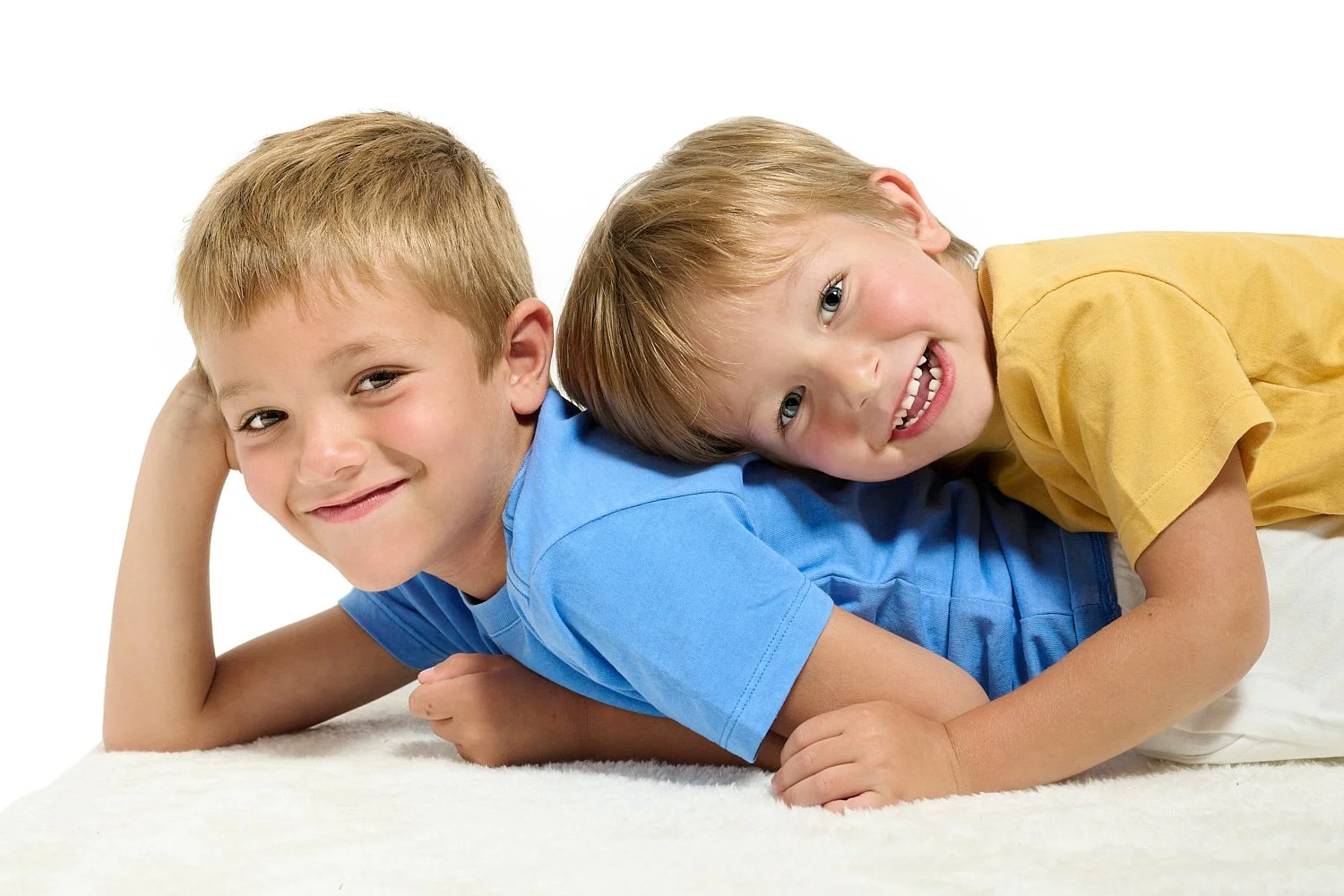  Lauren Stoecklein brought her two sons for a custom photo session in a professional studio and requested white background for a clean and timeless look for the wall art in her new house. 