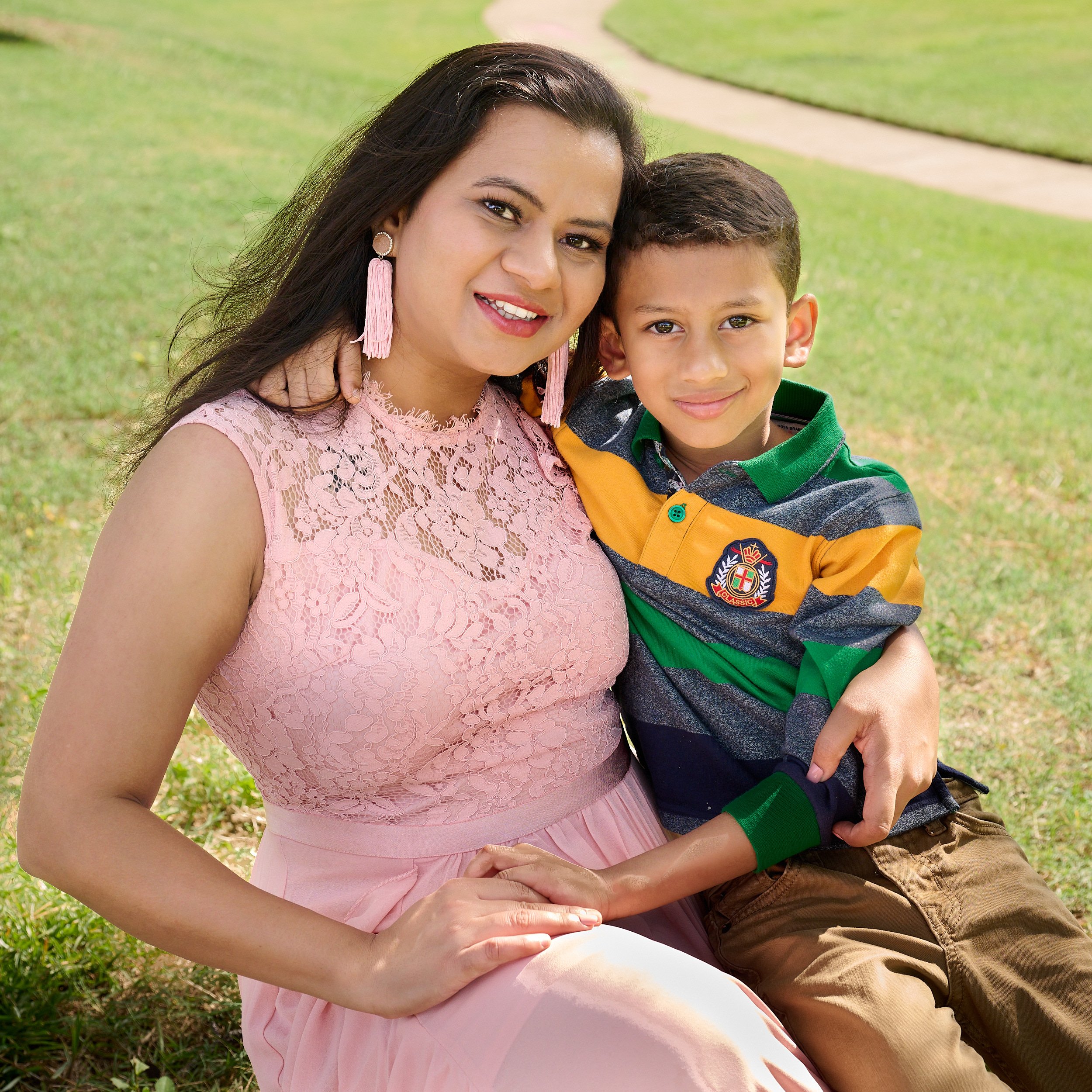  CYPRESS, TEXAS - SEPTEMBER 17TH 2022: a photo session at Cypress Creek Lakes Park on a hot and sunny summer day. Ragini Deore is posing for their annual family portraits for Christmas cards & wall art 