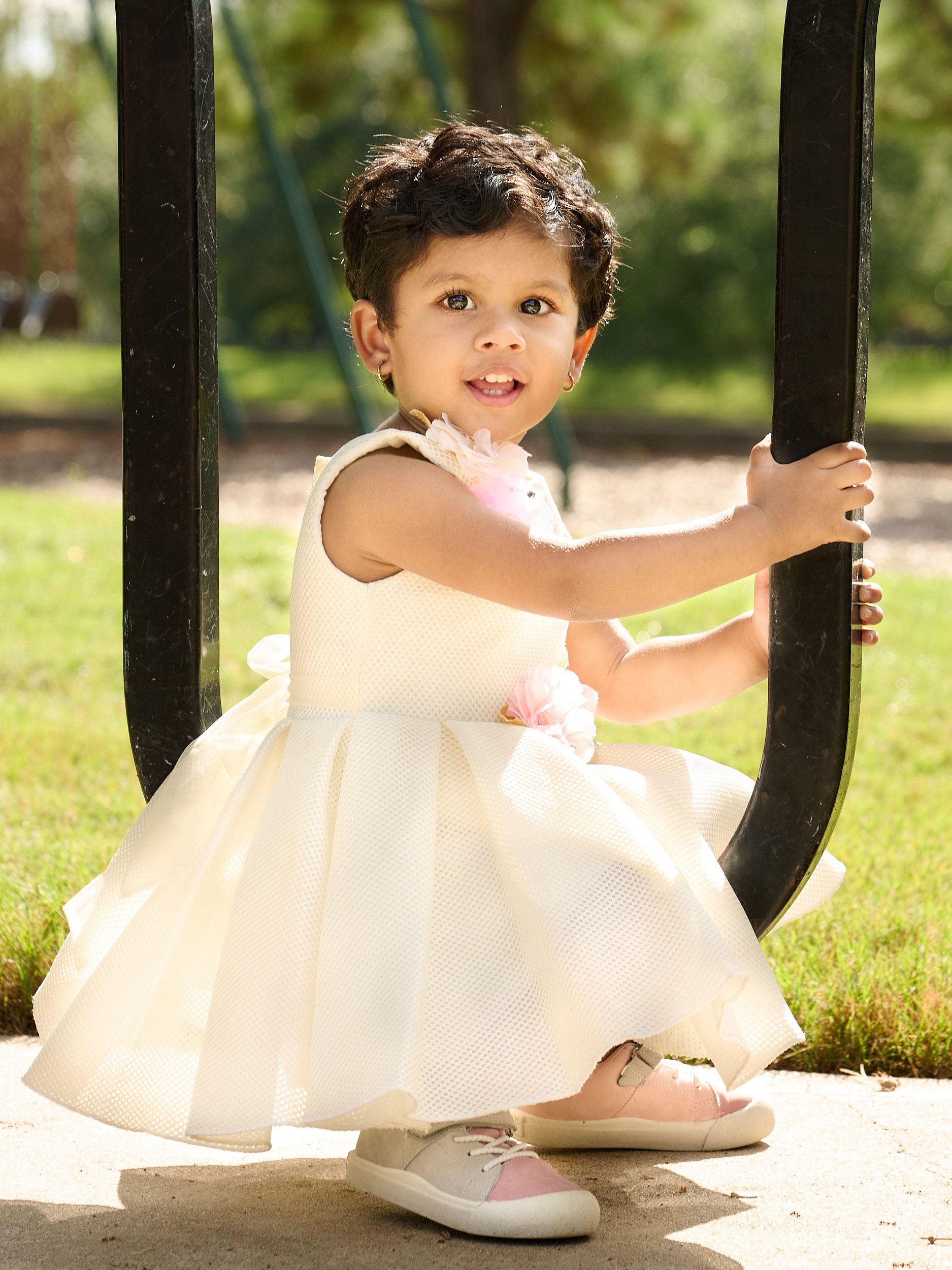  CYPRESS, TEXAS - SEPTEMBER 17TH 2022: a photo session at Cypress Creek Lakes Park on a hot and sunny summer day. Ragini Deore is posing for their annual family portraits for Christmas cards & wall art 