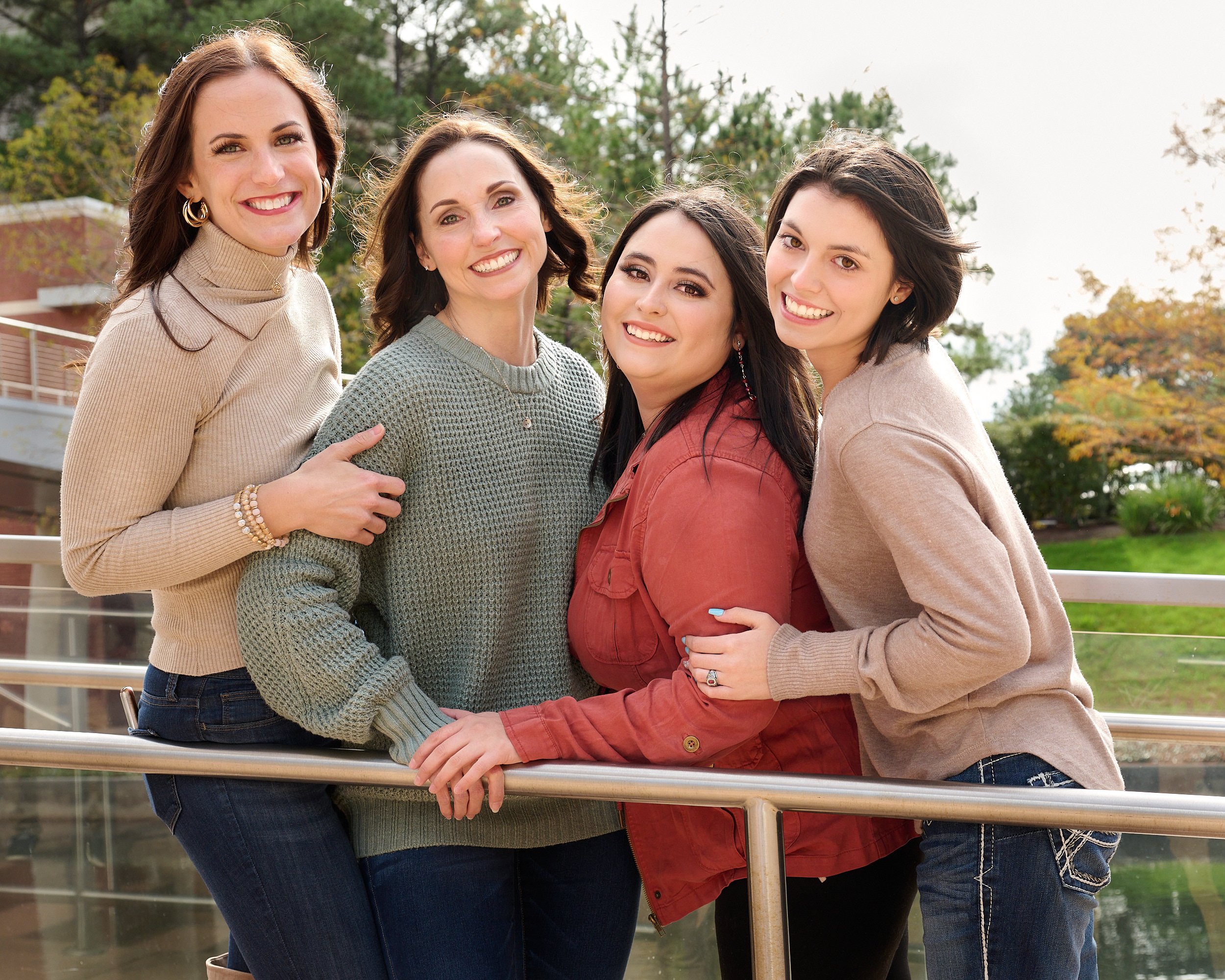  THE WOODLANDS, TEXAS - DECEMBER 2022: Katie Sikorski and her 12 family members are posing for annual Christmas cards on the embankment of The Woodlands Waterway. Fall foliage colors are still there. 