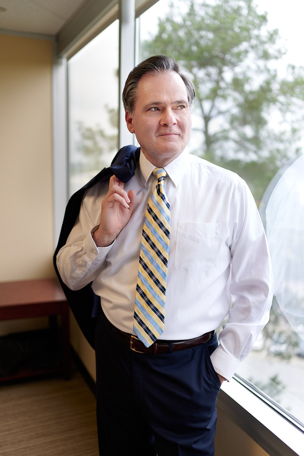  THE WOODLANDS, TEXAS - APRIL 2023: Jim Sloan, a wealth manager at Jim Sloan & Associates, is posing in his office for a feature in Living Magazine South about the rising tax environment & retirement. 