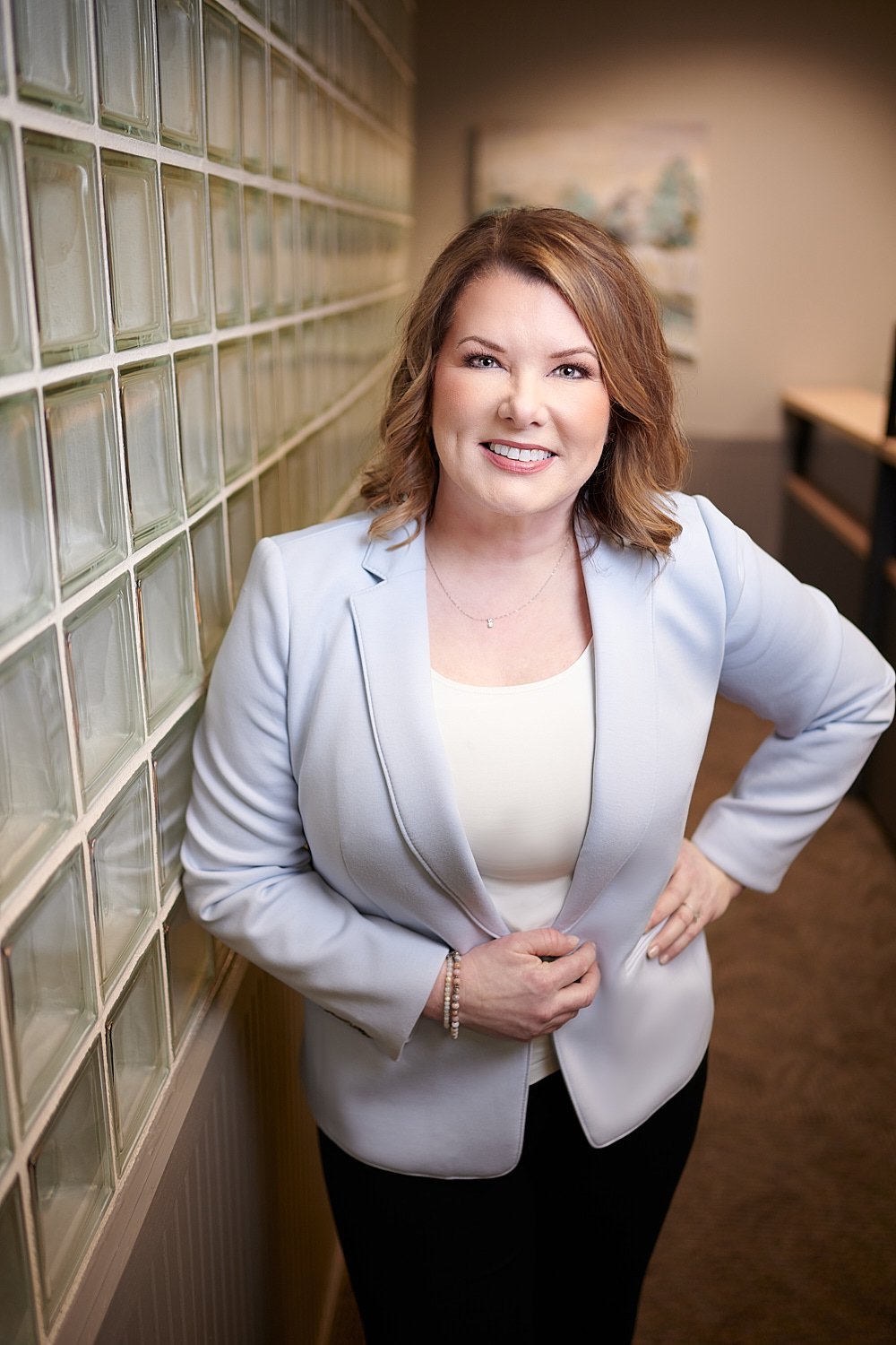  THE WOODLANDS, TEXAS - FEBRUARY 2023: a dental surgeon is posing for environmental business portraits in her practice. She specializes in Laser Dentistry, DURAthin, Lumineer veneers, dental implants. 