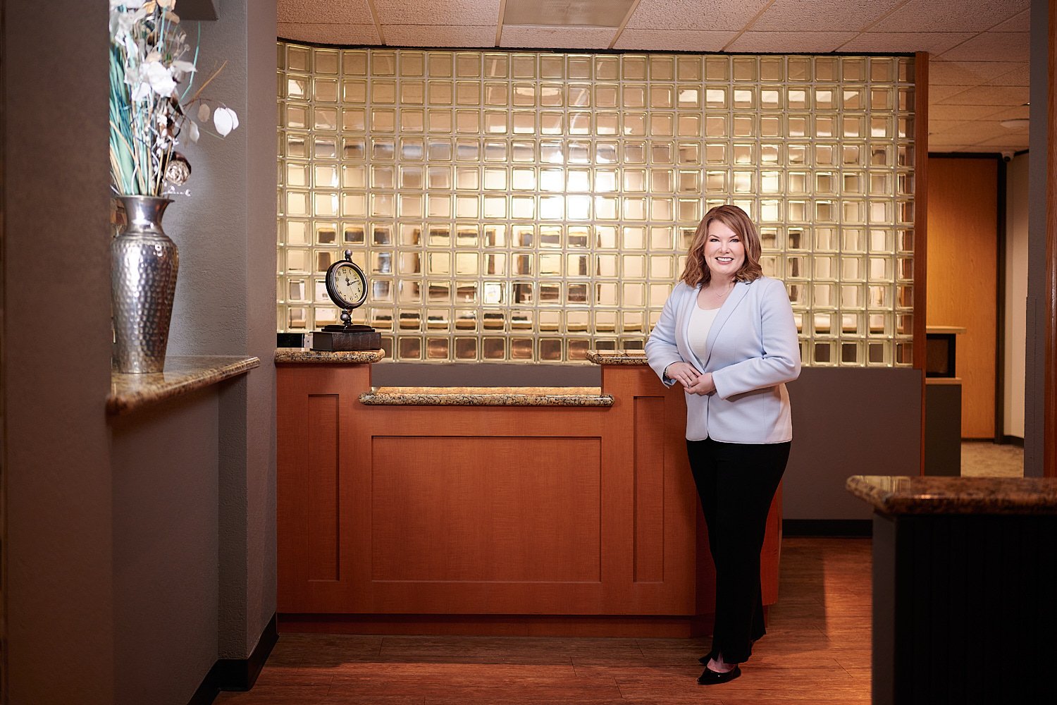  THE WOODLANDS, TEXAS - FEBRUARY 2023: a dental surgeon is posing for environmental business portraits in her practice. She specializes in Laser Dentistry, DURAthin, Lumineer veneers, dental implants. 