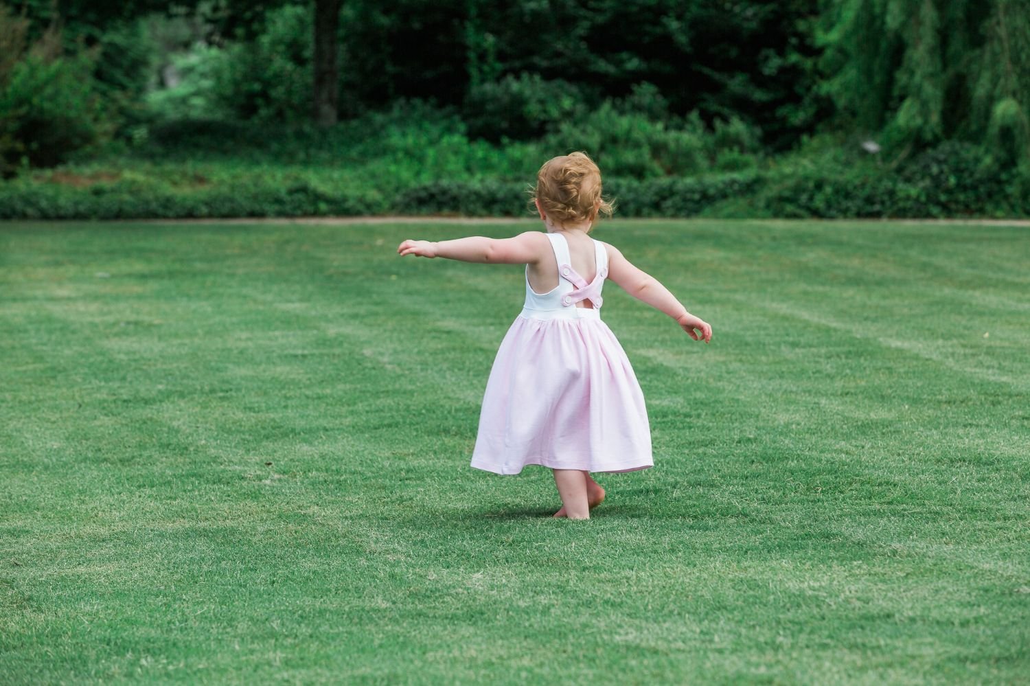 girl-twirling-grass.jpg
