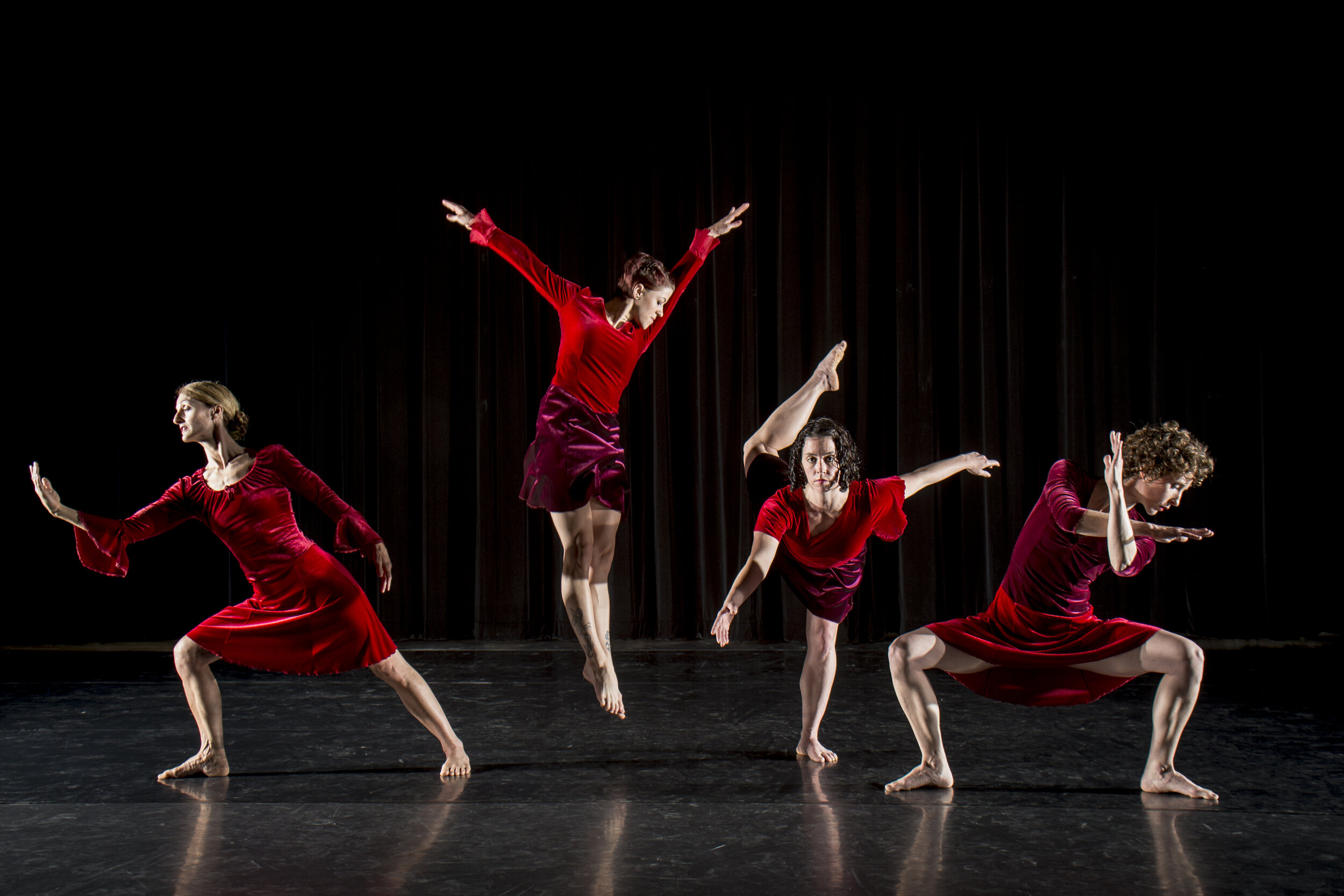 Company Dancers Moving on Stage in Red