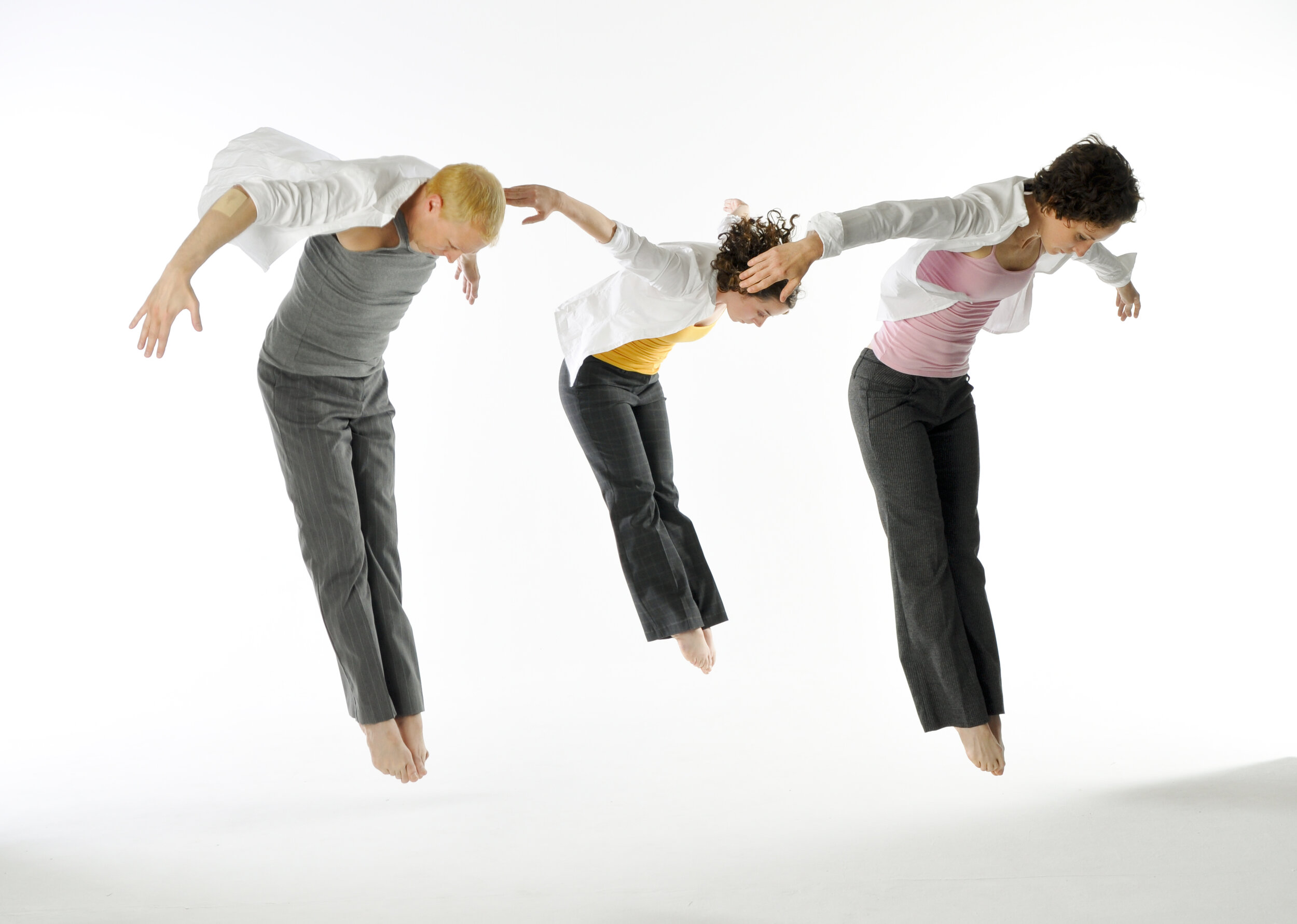 Three Company Dancer's Jumping in Pike Position