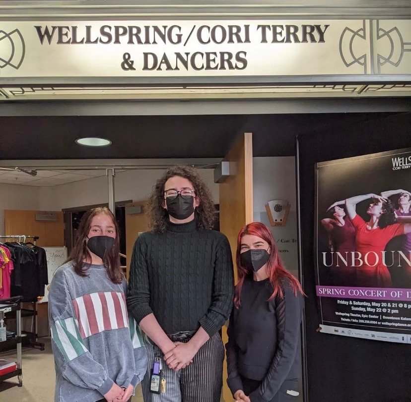 Three Volunteers in front of Wellsprings Theater