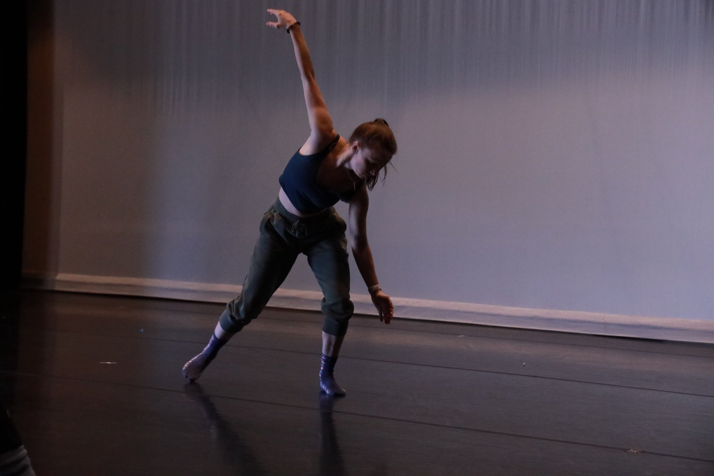 Emily in side left lunge arms extended outward vertically