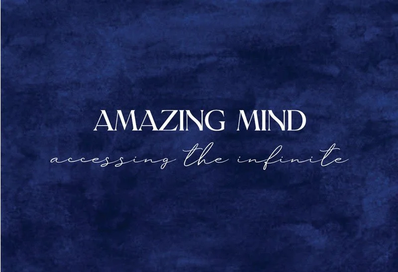 Dark blue textured background with the text "AMAZING MIND" in large white letters and "accessing the infinite" in smaller cursive script below.