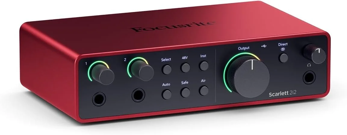 The scarlett focusrite 2i2 audio interface in a bold red color.