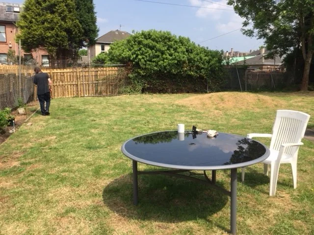 Back garden round table Tommy.JPG