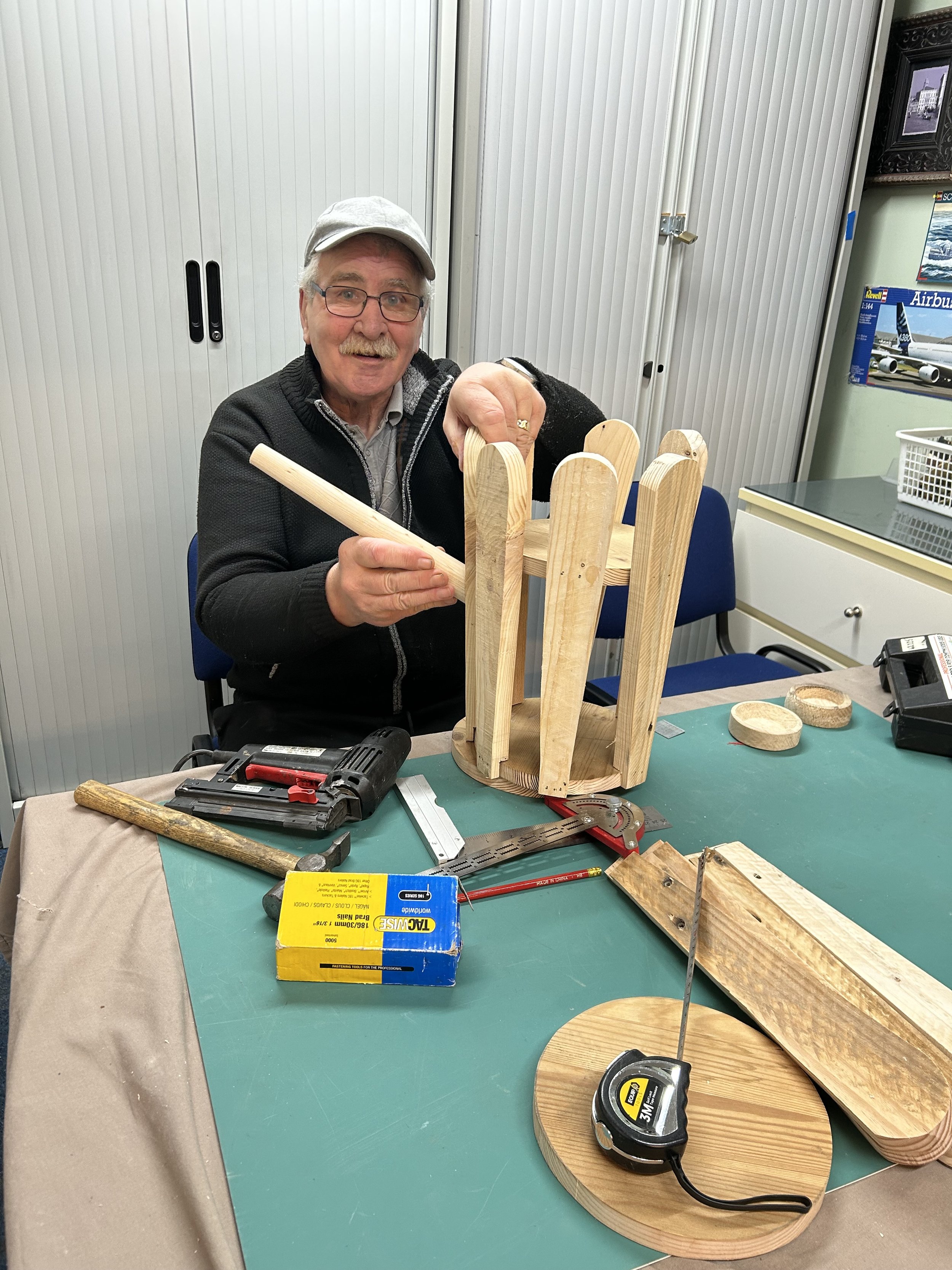 Bobby making watering can planters