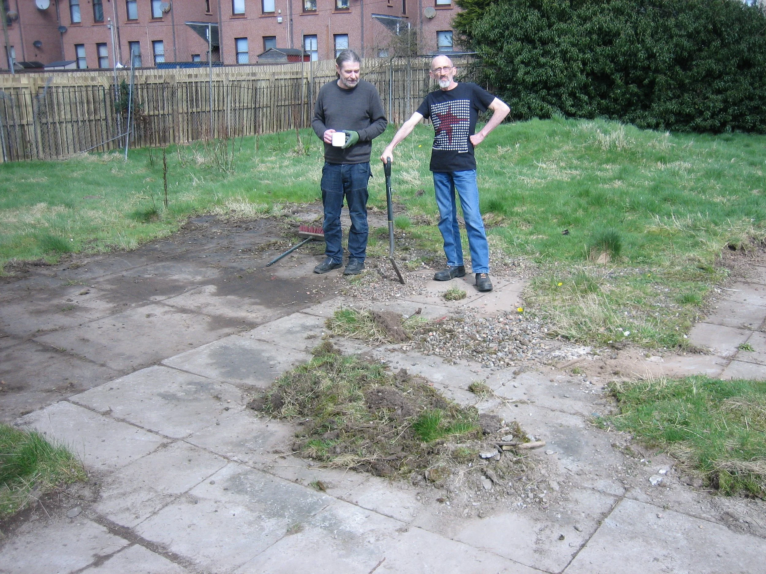 Tam and Frank clearing all the weeds and long grass