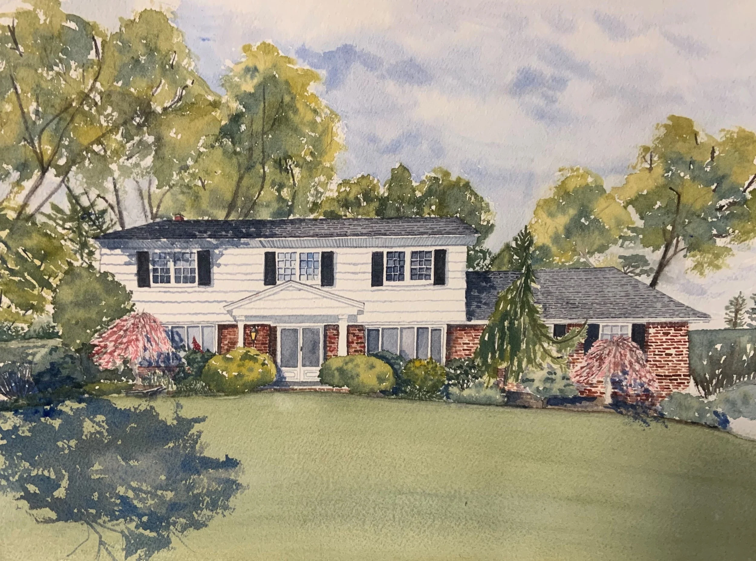 Watercolor painting of a suburban house with white siding and brick accents, surrounded by trees, bushes, and a lawn, under a partly cloudy sky.
