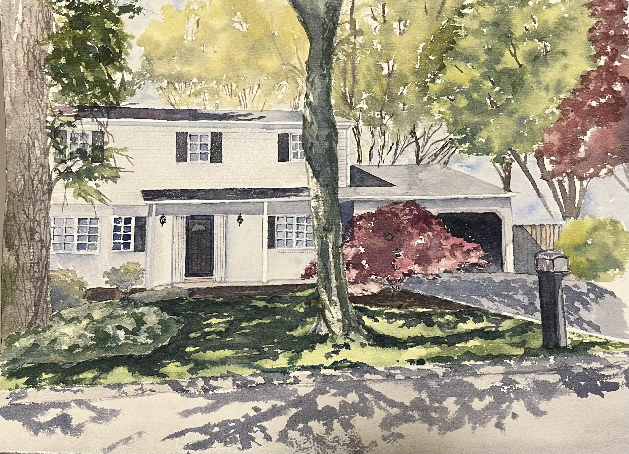 Watercolor painting of a house with a front yard, trees, shrubs, and a driveway with a mailbox.