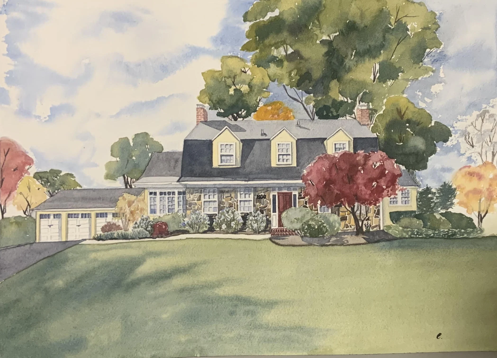 Watercolor painting of a large house with a manicured lawn, trees with autumn-colored leaves, and a partly cloudy sky.