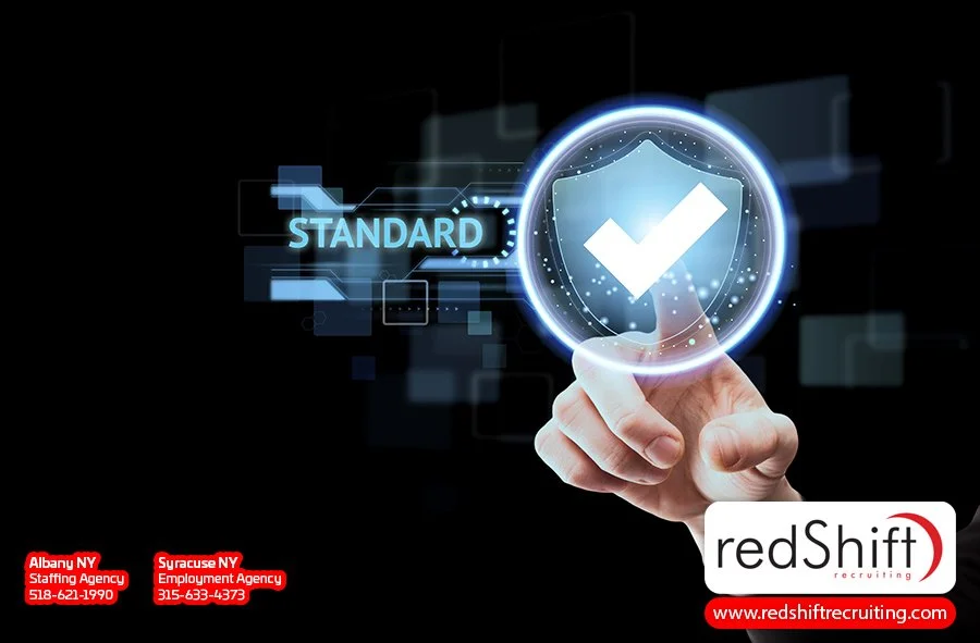 "Futuristic interface showing a hand interacting with a shield icon and the word 'Standard,' representing the importance of compliance and quality standards in W3C certifications for technology recruiting."