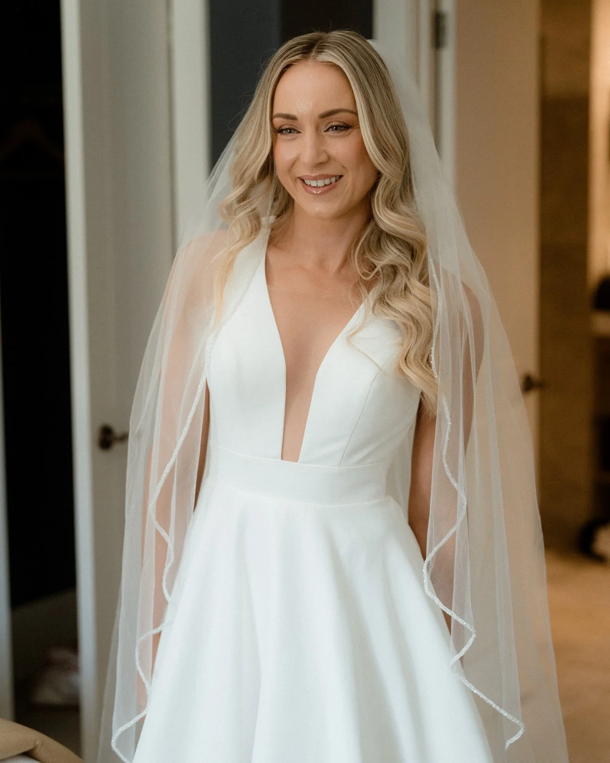 queenstown bride first look in her wedding dress with amazing wedding hair and makeup
