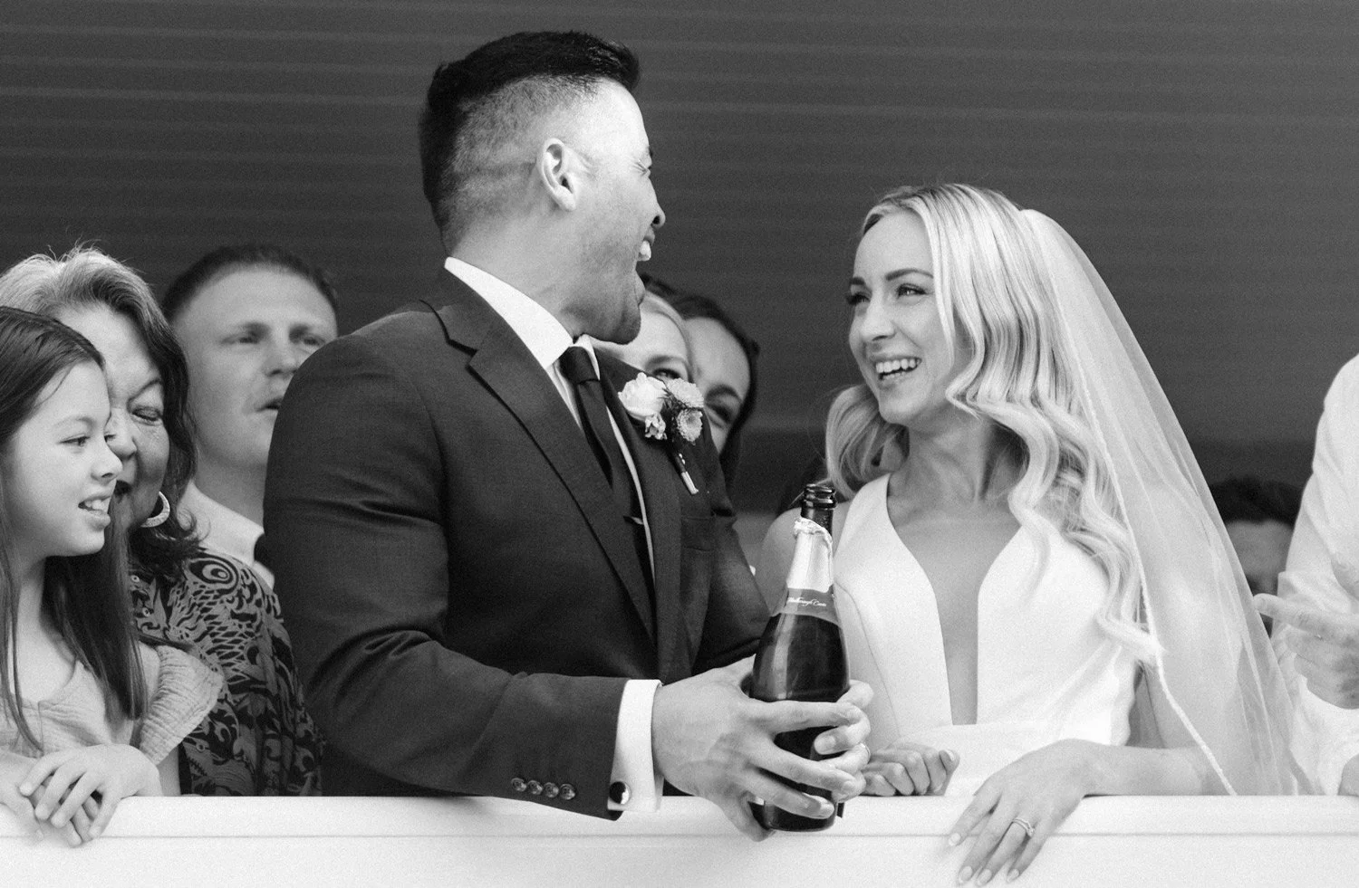 Bride and groom sharing moment during champagne pop at millbrook in Queenstown
