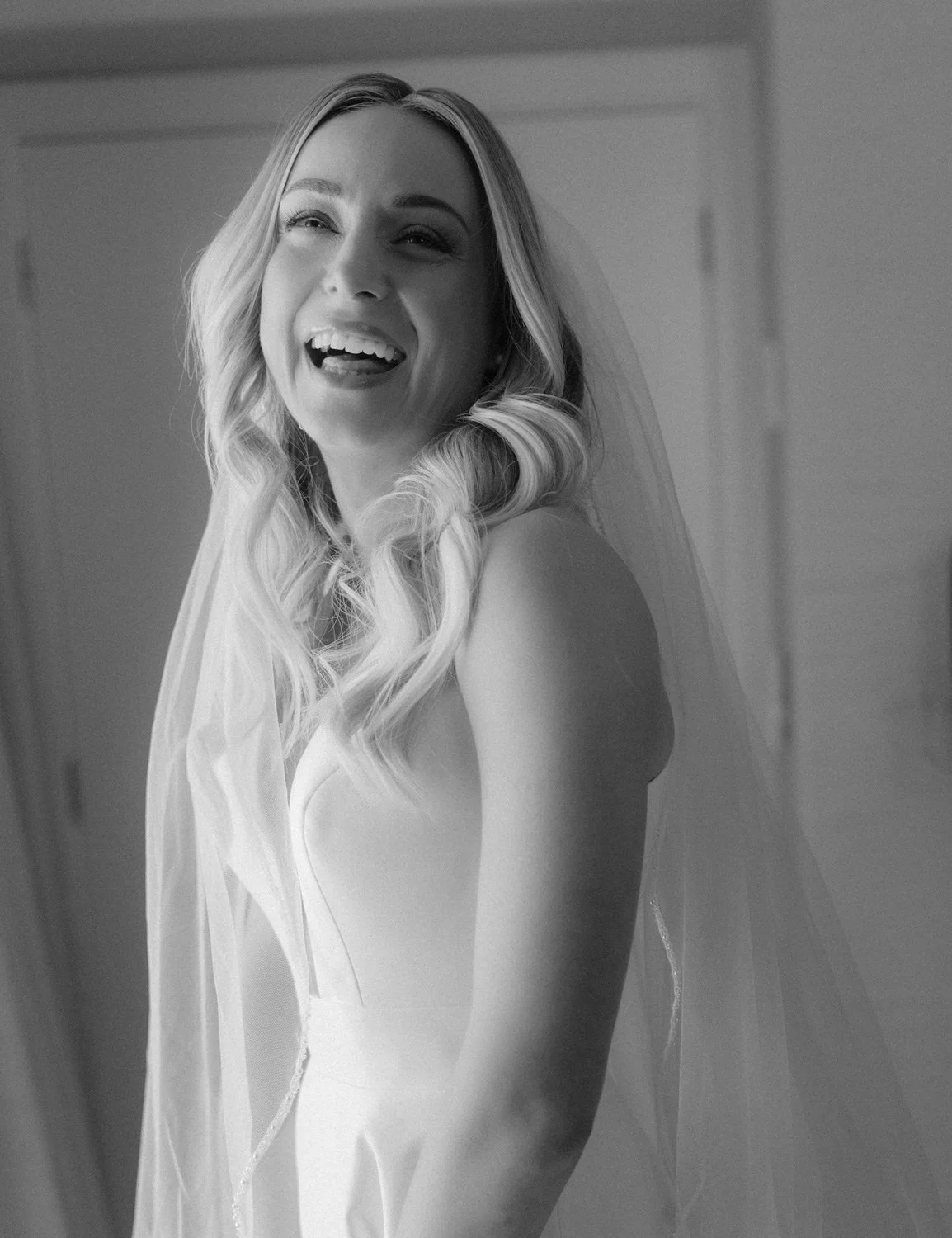 editorial wedding photographer in queenstown of bride laughing