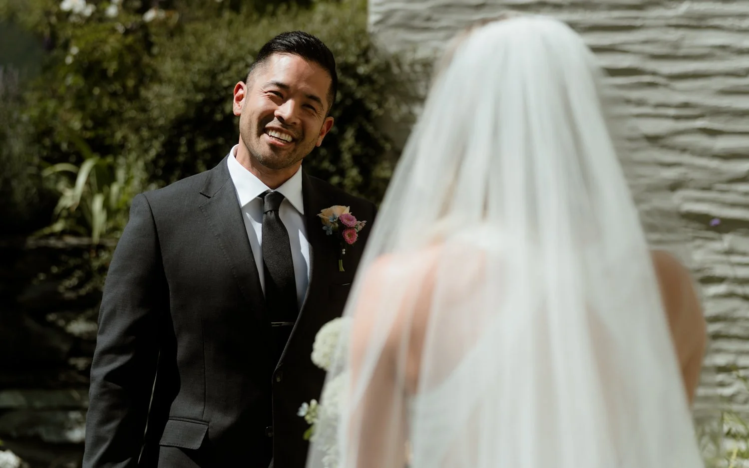 groom smiling at bride at millbrook wedding