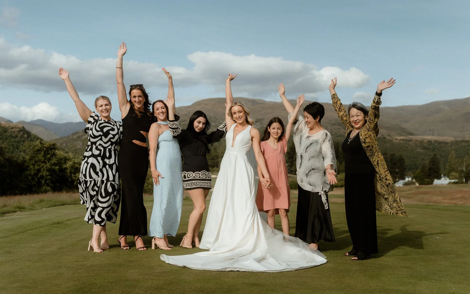 bridesmaids celebrating on golf course at Queenstown Millbrook wedding