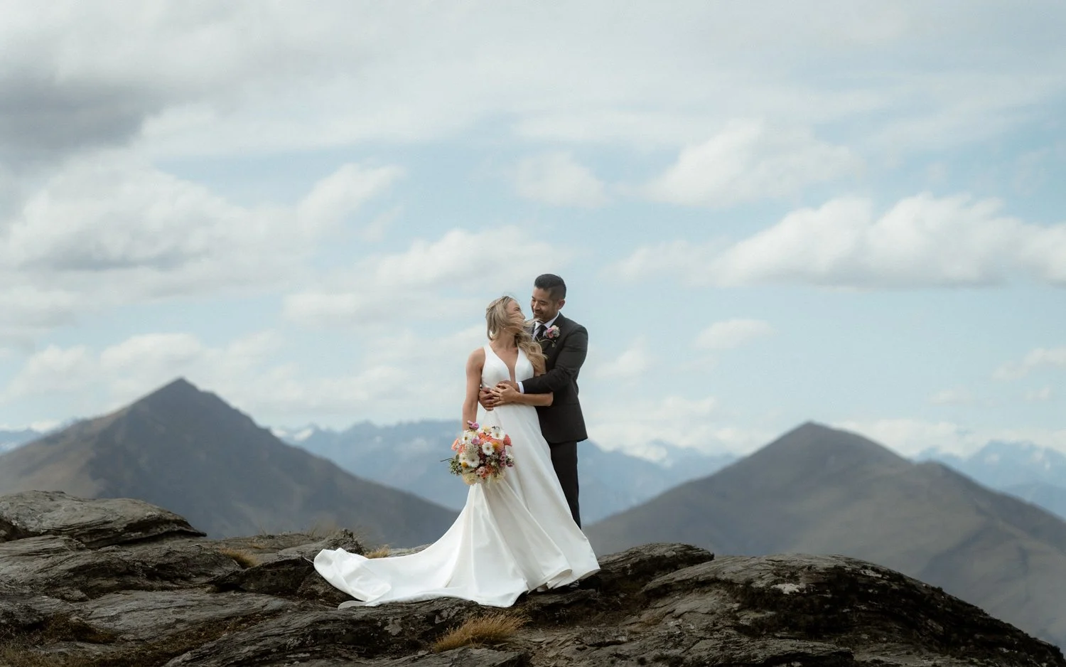couple photographer in Queenstown up Cecil Peak with southern Alps in background