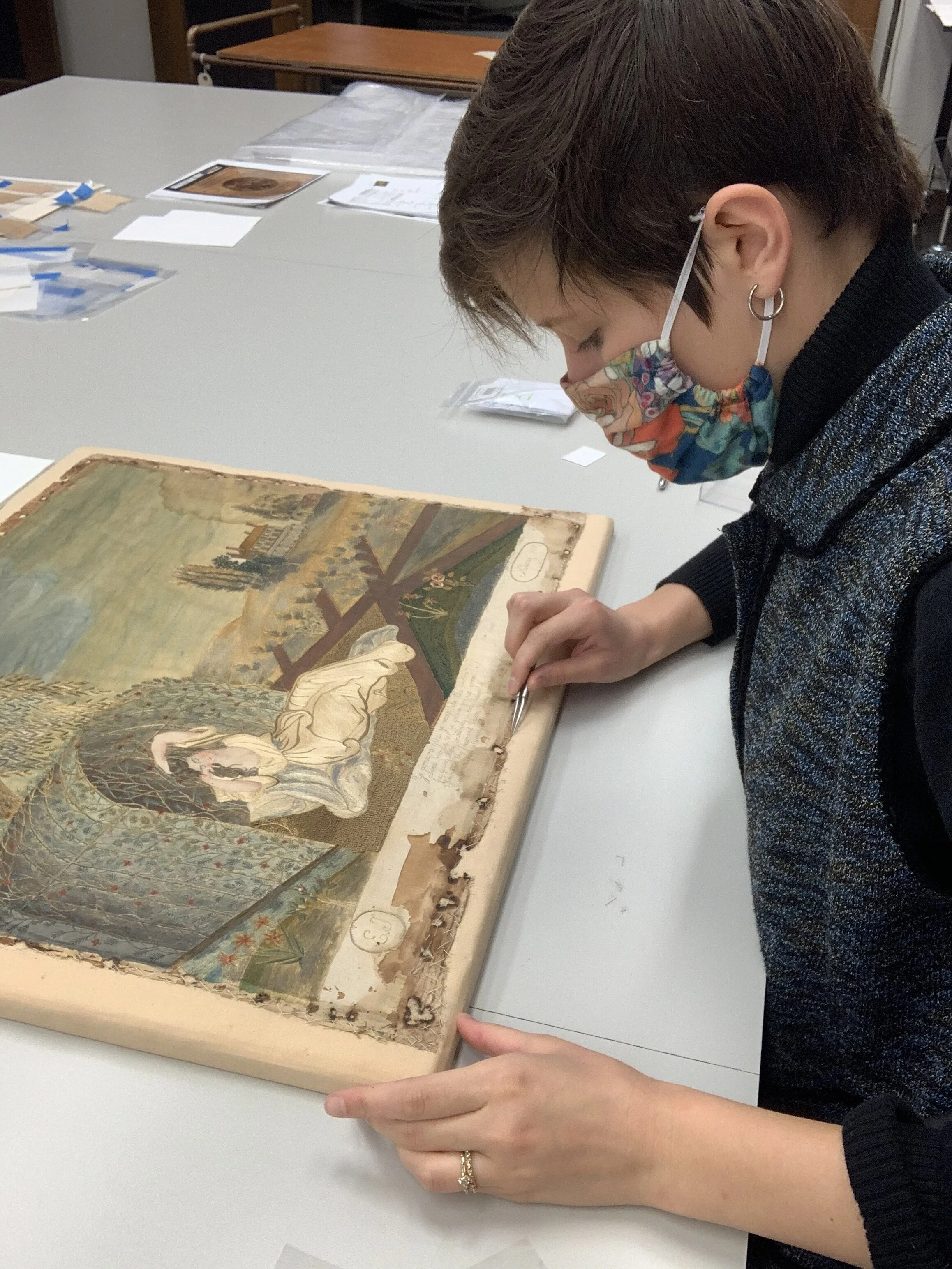 1. The textile was removed from its mount.