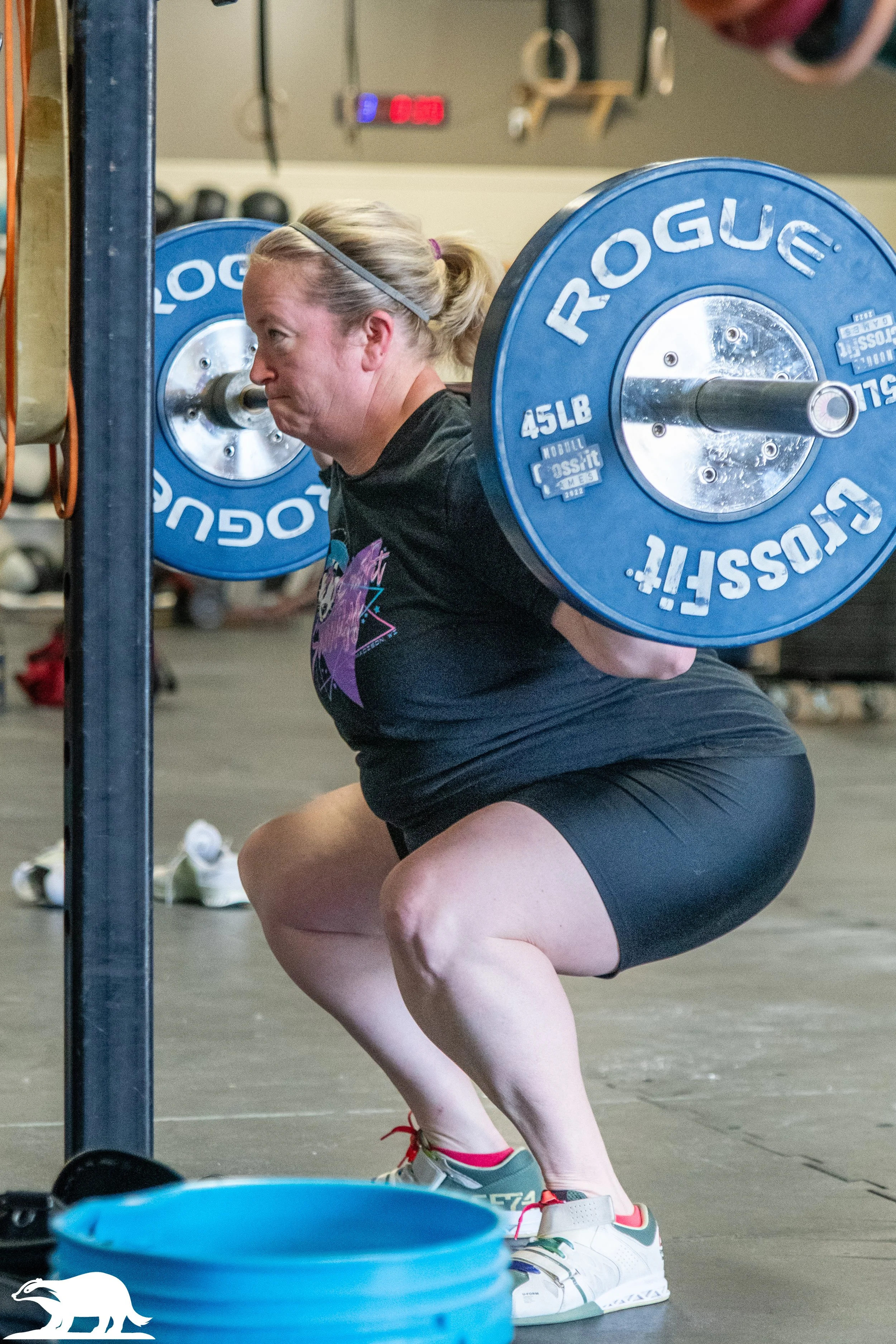 woman barbell back squats